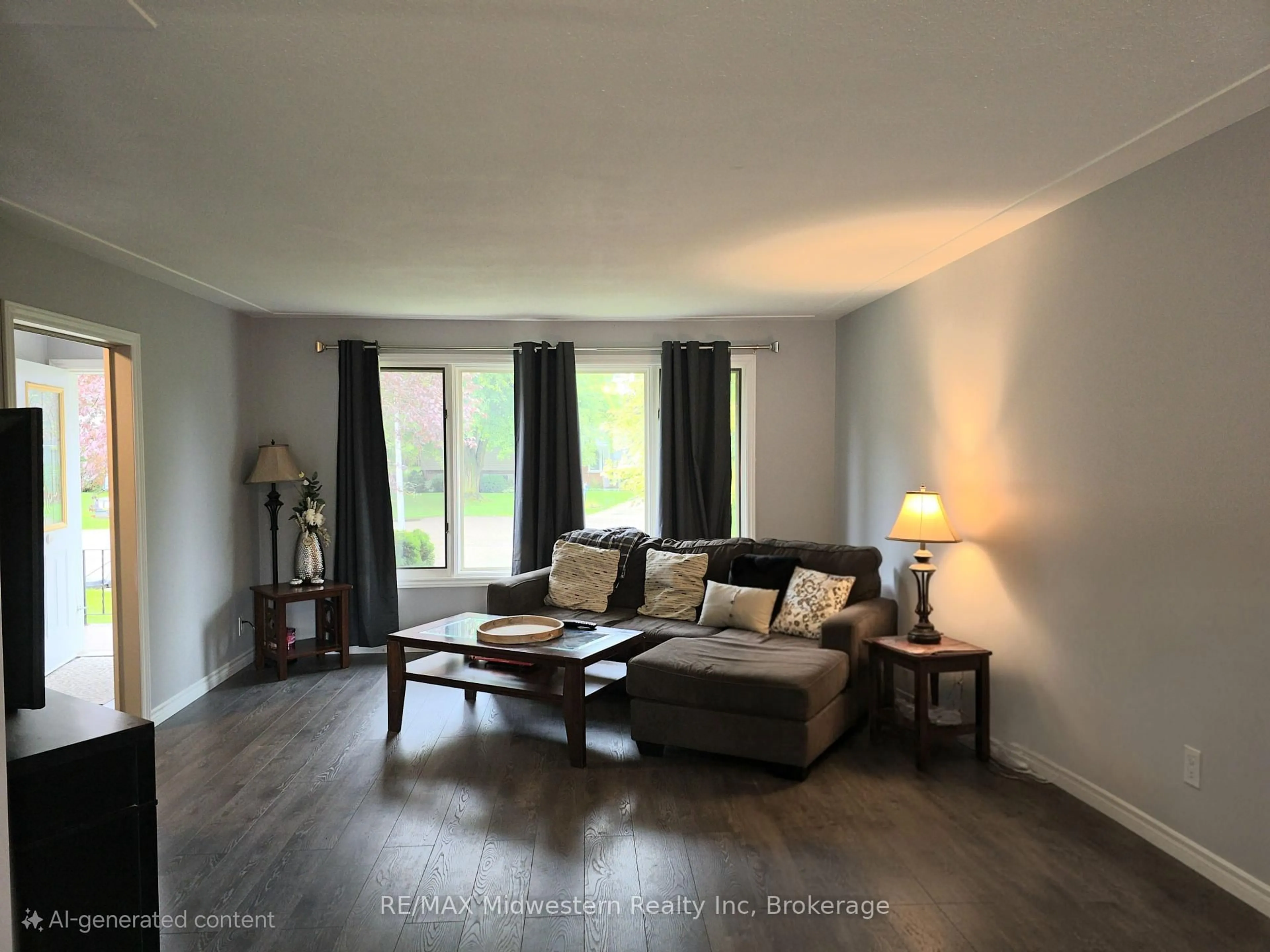 Living room with furniture, wood/laminate floor for 2 Kilberg Crt, North Perth Ontario N4W 1P1