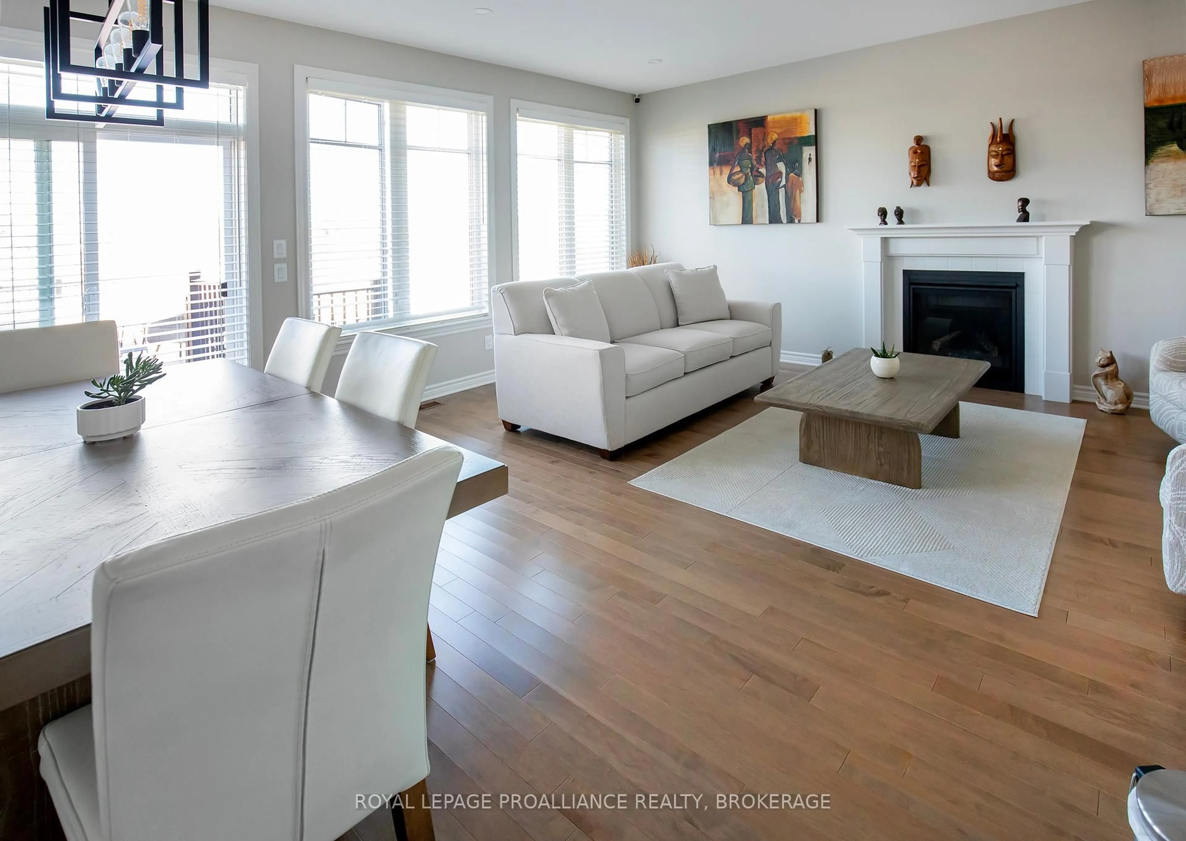 Living room with furniture, wood/laminate floor for 1390 Demers Ave, Kingston Ontario K7M 0H8