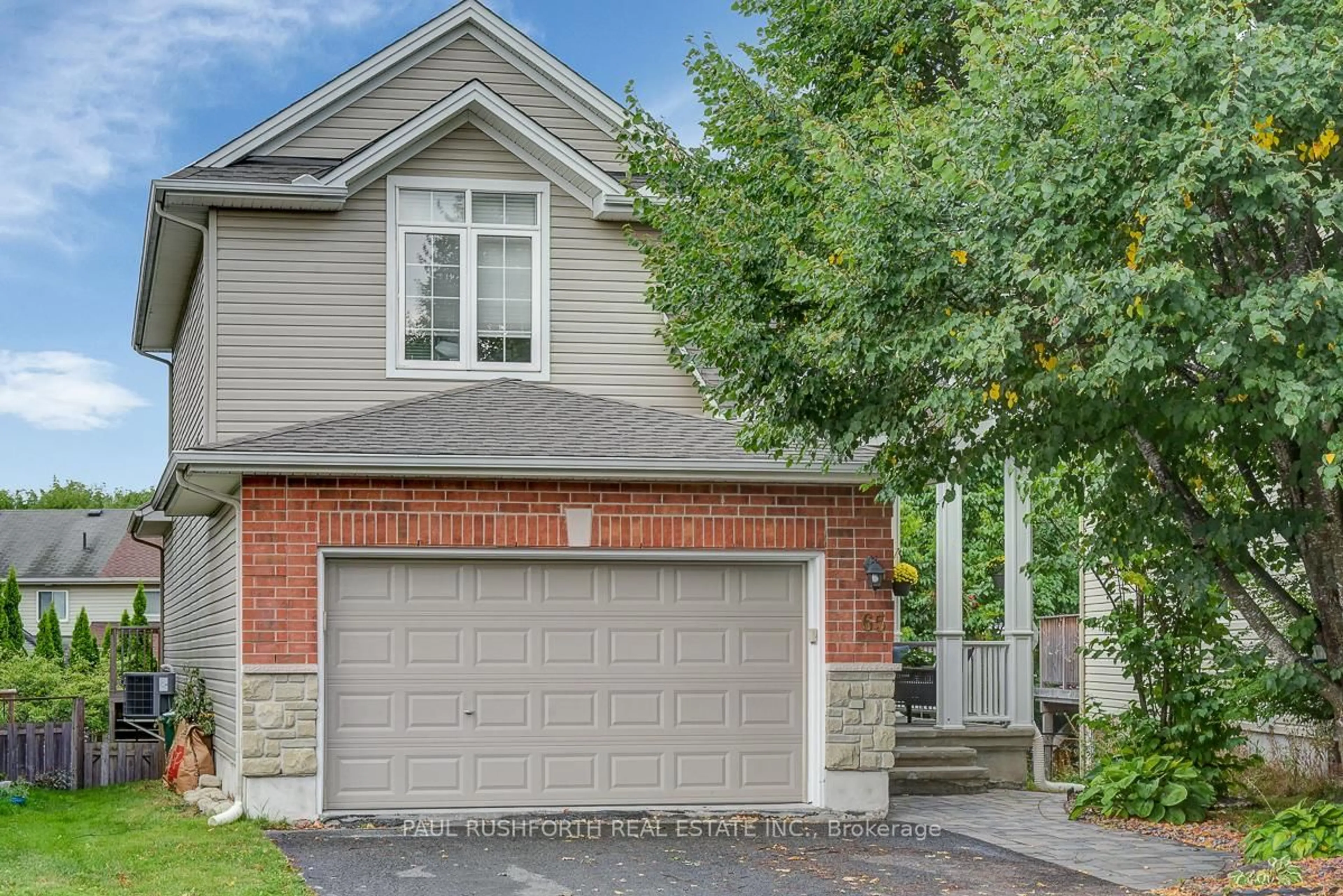Home with brick exterior material, street for 65 Polo Lane, Ottawa Ontario K2M 2Y4