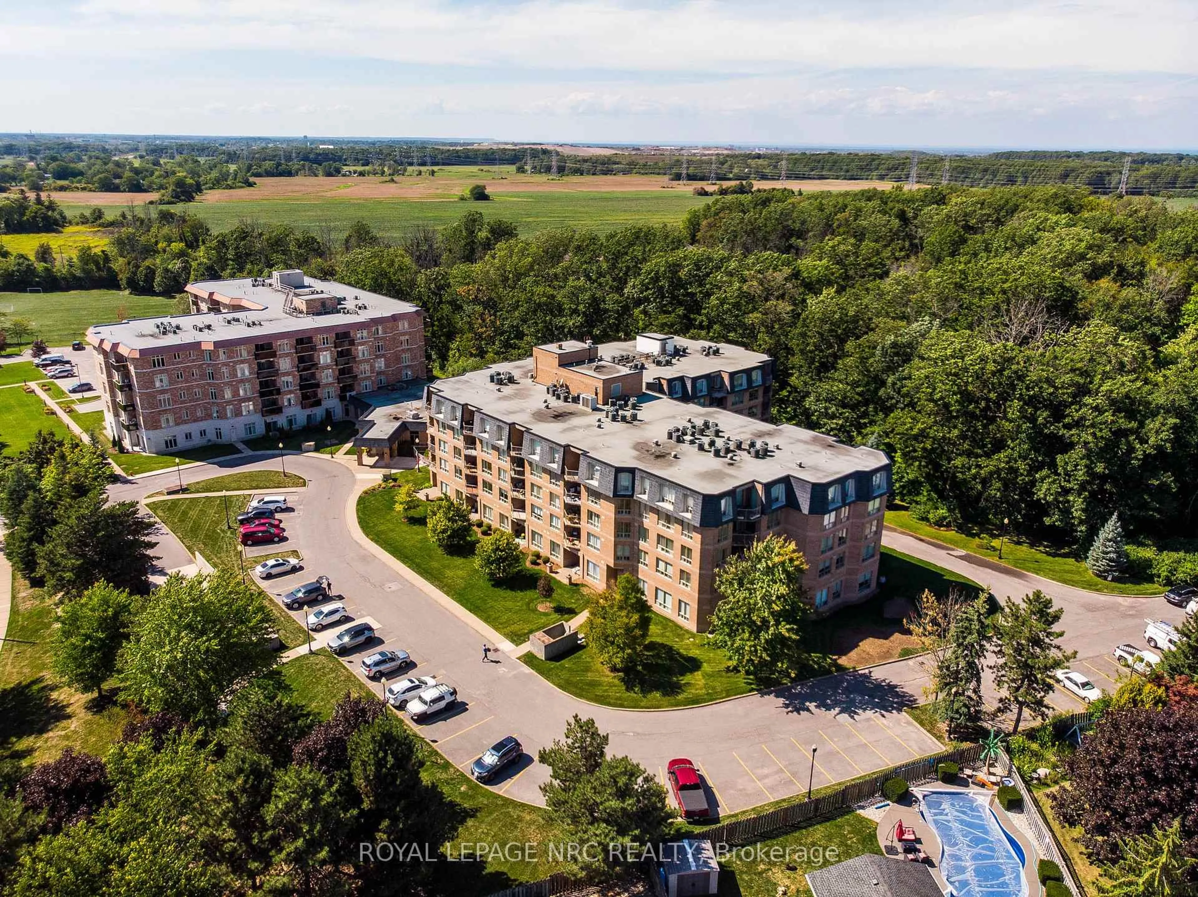 A pic from outside/outdoor area/front of a property/back of a property/a pic from drone, building for 8111 Forest Glen Dr #401, Niagara Falls Ontario L2H 2Y7