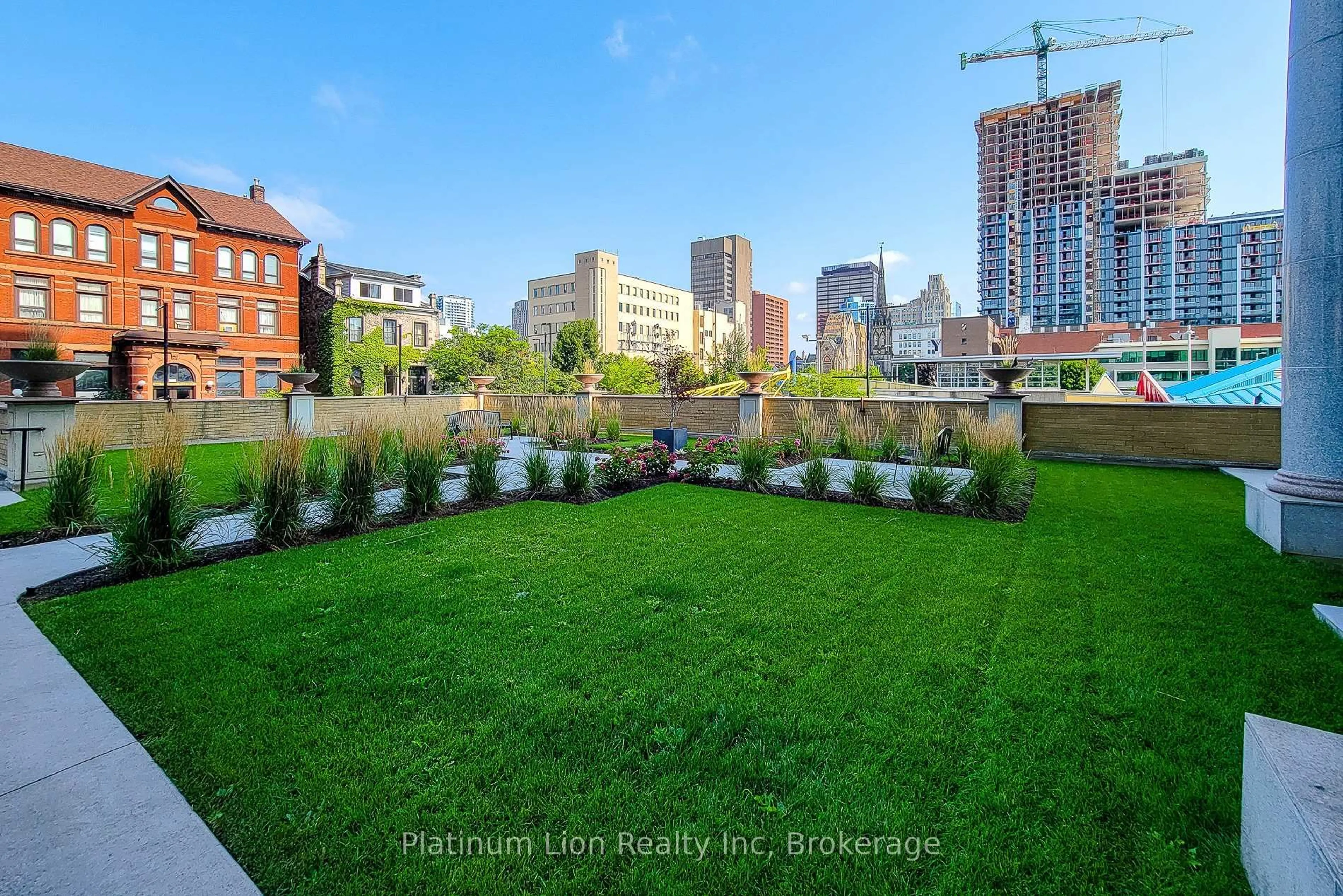 Patio, city buildings view from balcony for 135 James St #402, Hamilton Ontario L8P 2Z6