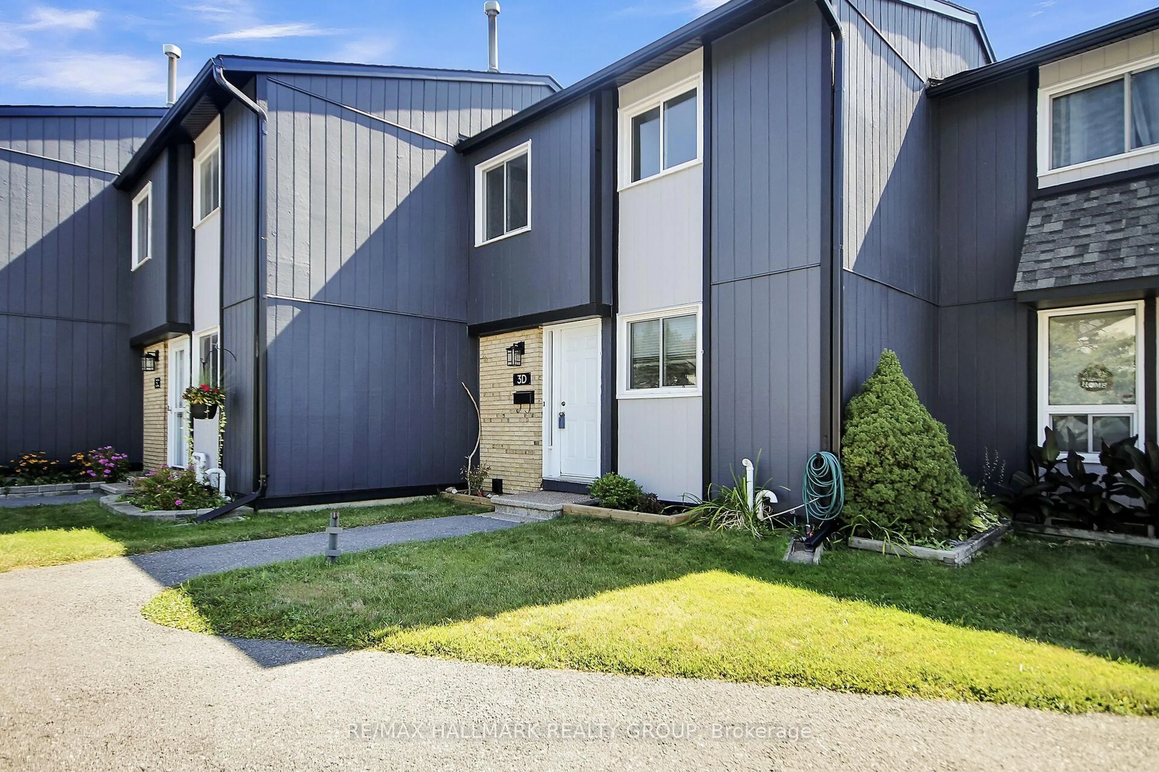 Home with vinyl exterior material, street for 3 Spring Grove Lane #D, Barrhaven Ontario K2J 2C5