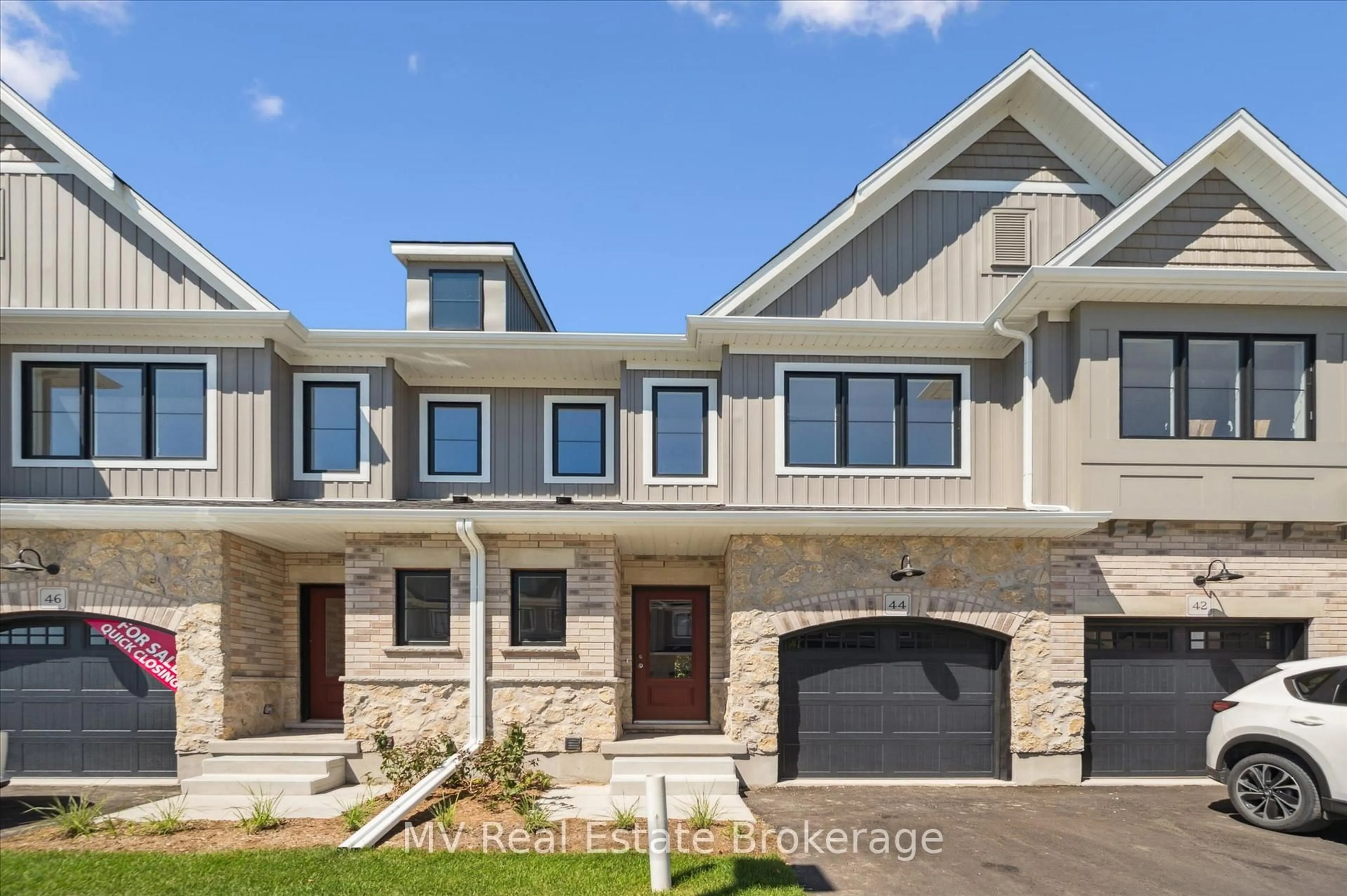 Home with brick exterior material, street for 44 Fieldstone Lane Private, Centre Wellington Ontario N0B 1S0