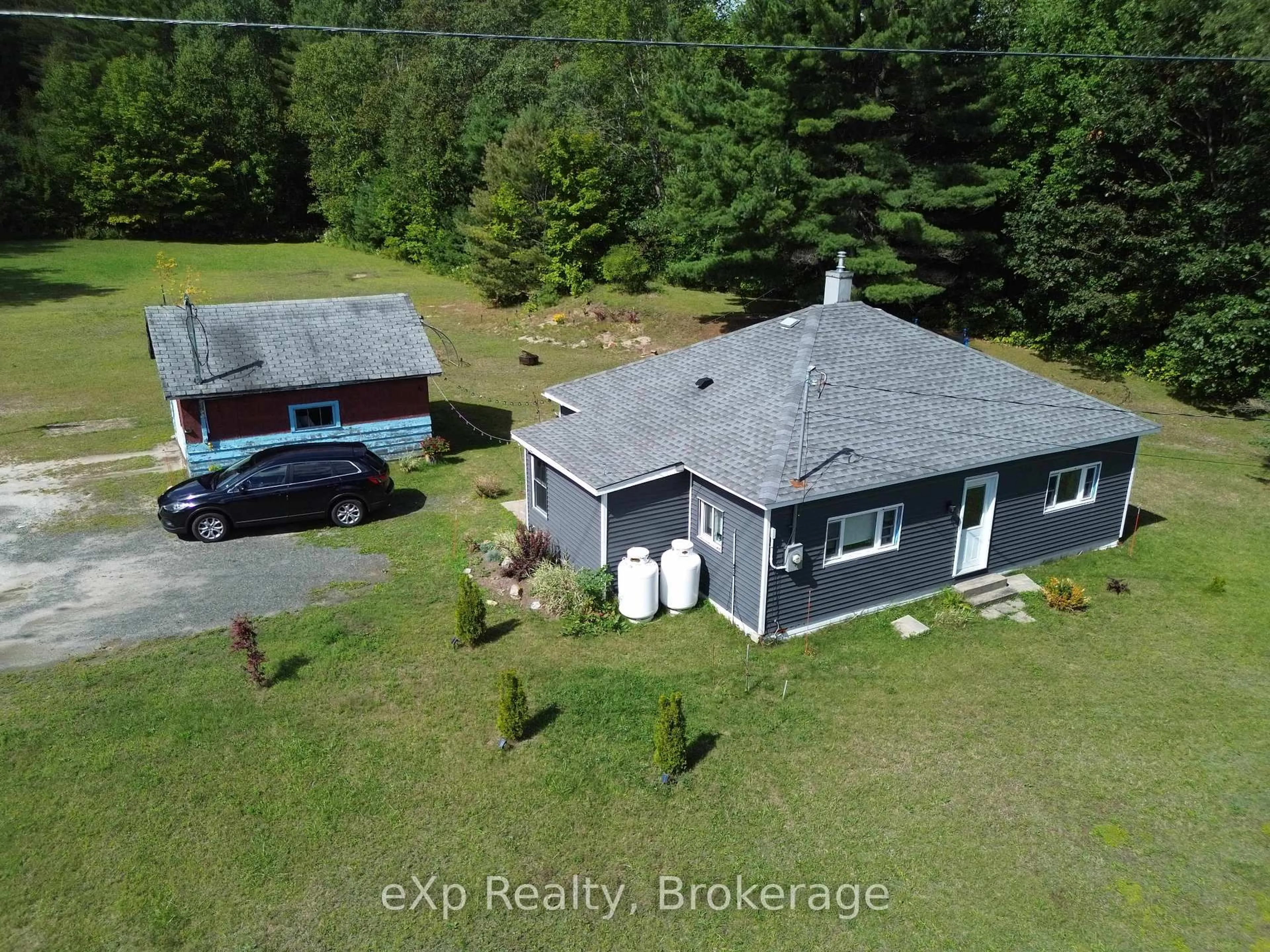 A pic from outside/outdoor area/front of a property/back of a property/a pic from drone, water/lake/river/ocean view for 62 Highway 124, McDougall Ontario P2A 2W9