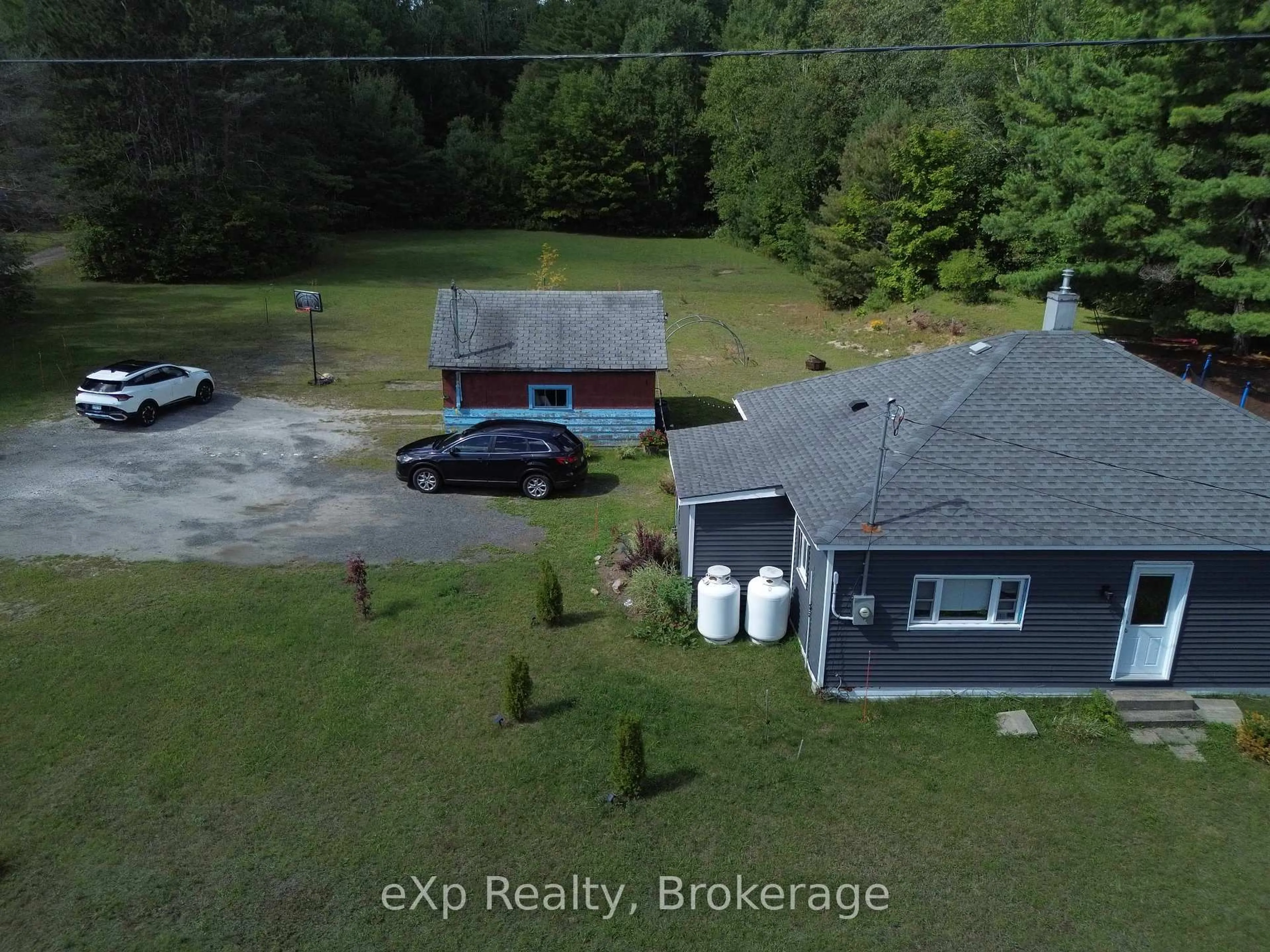 A pic from outside/outdoor area/front of a property/back of a property/a pic from drone, water/lake/river/ocean view for 62 Highway 124, McDougall Ontario P2A 2W9
