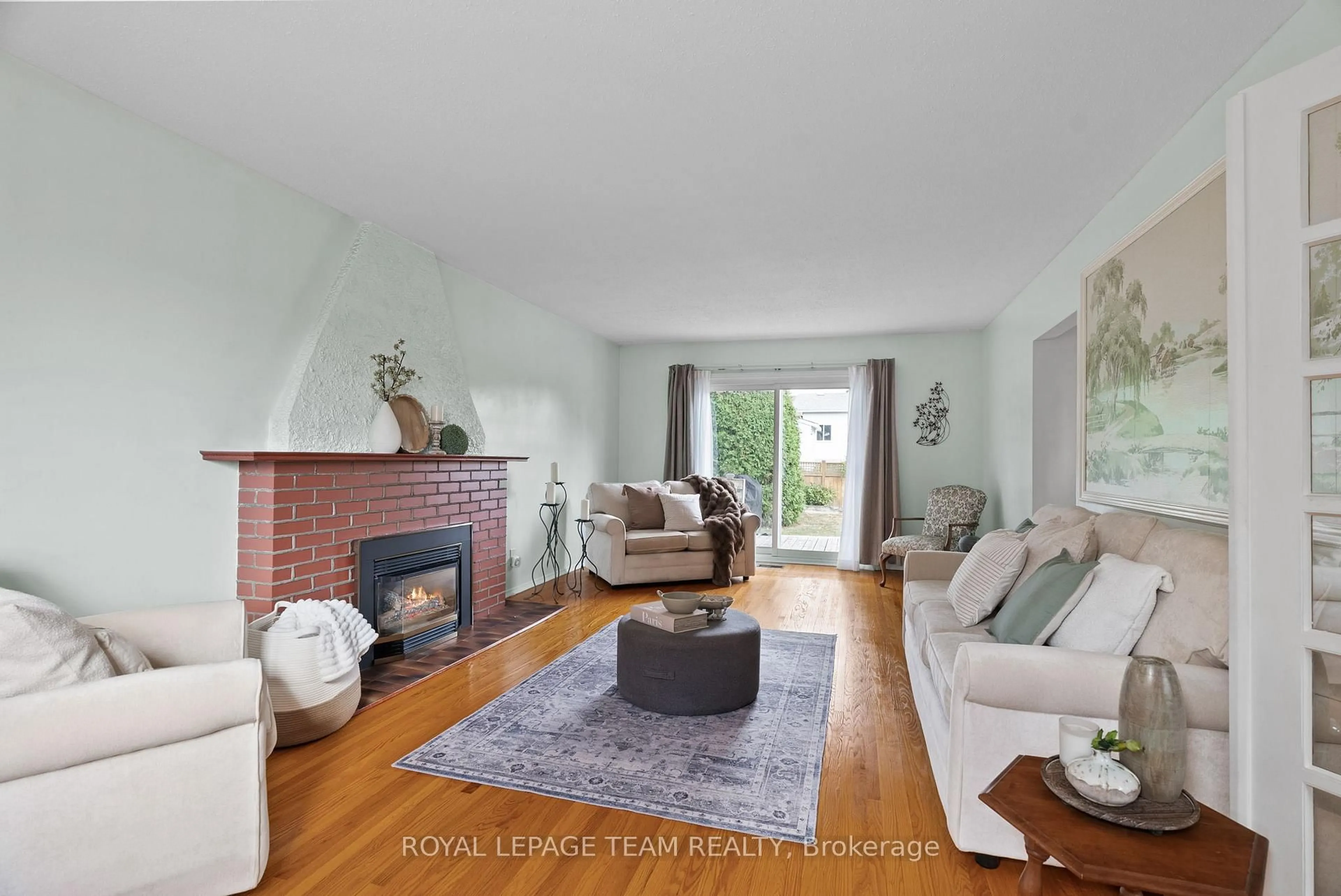 Living room with furniture, wood/laminate floor for 95 Coburn Ave, Kanata Ontario K2L 1G4