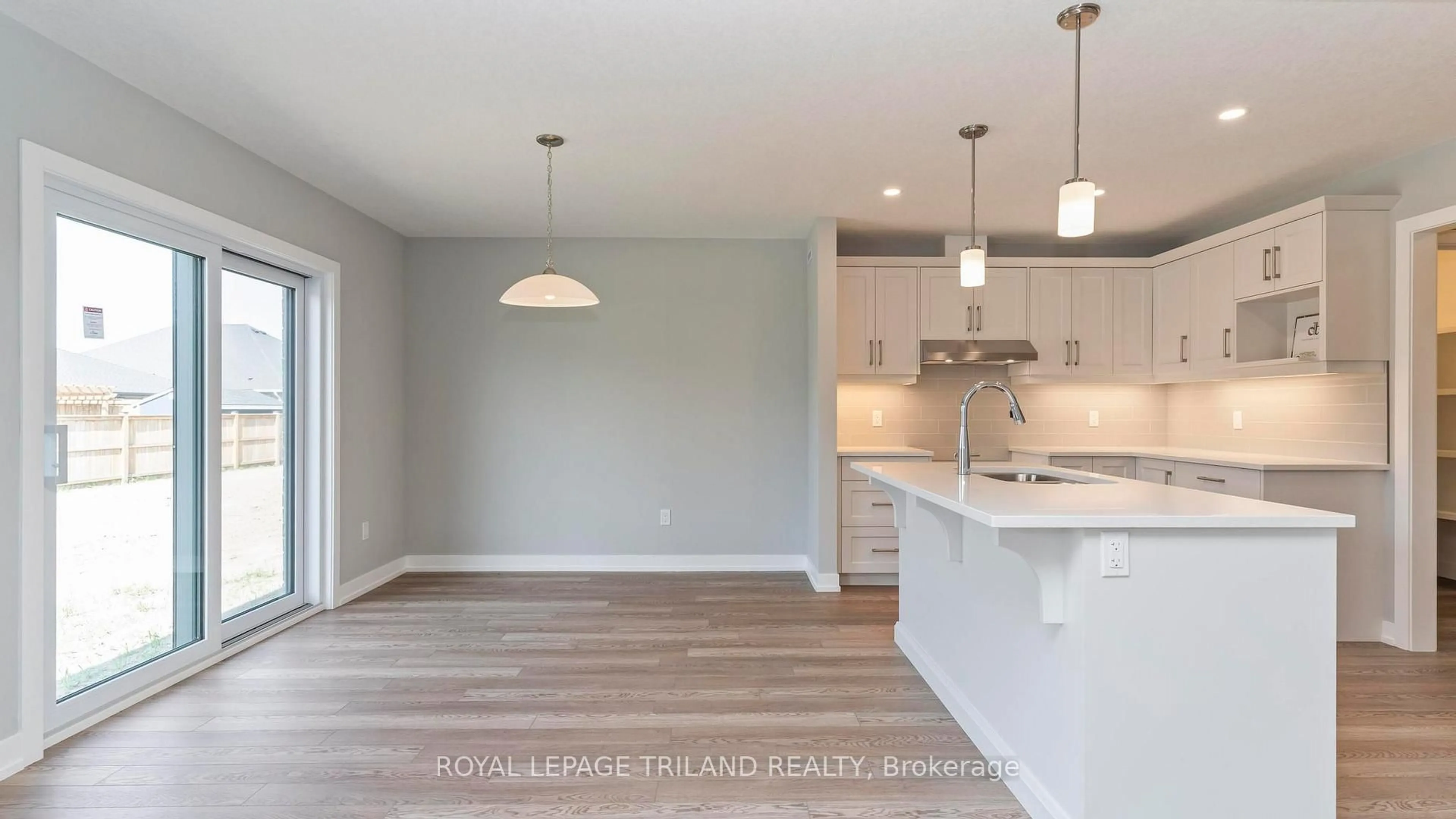 Open concept kitchen, wood/laminate floor for 114 STYLES Dr, St. Thomas Ontario N5R 0N8