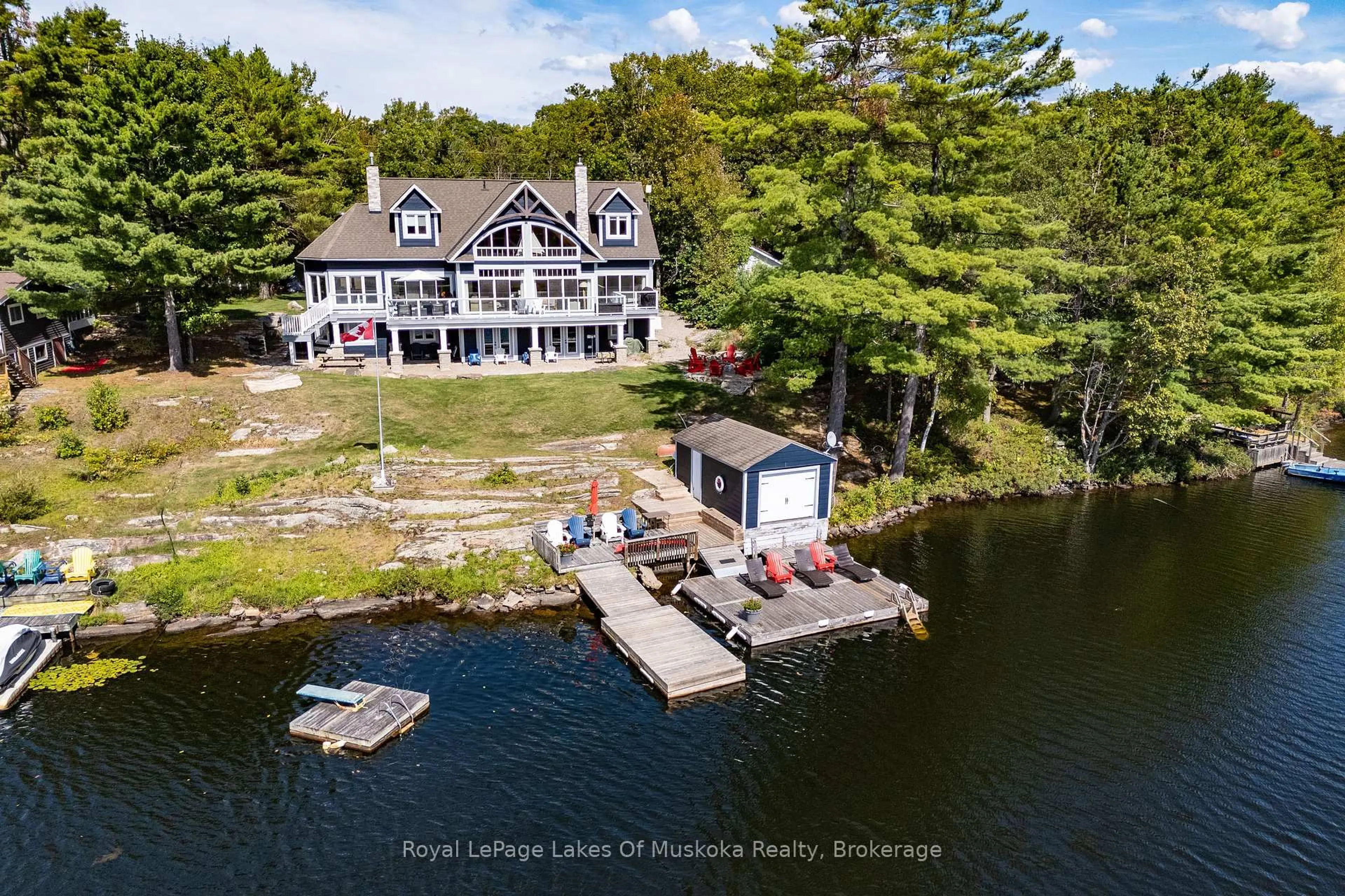 A pic from outside/outdoor area/front of a property/back of a property/a pic from drone, water/lake/river/ocean view for 29 Loon Lake Rd, Gravenhurst Ontario P1P 1R2