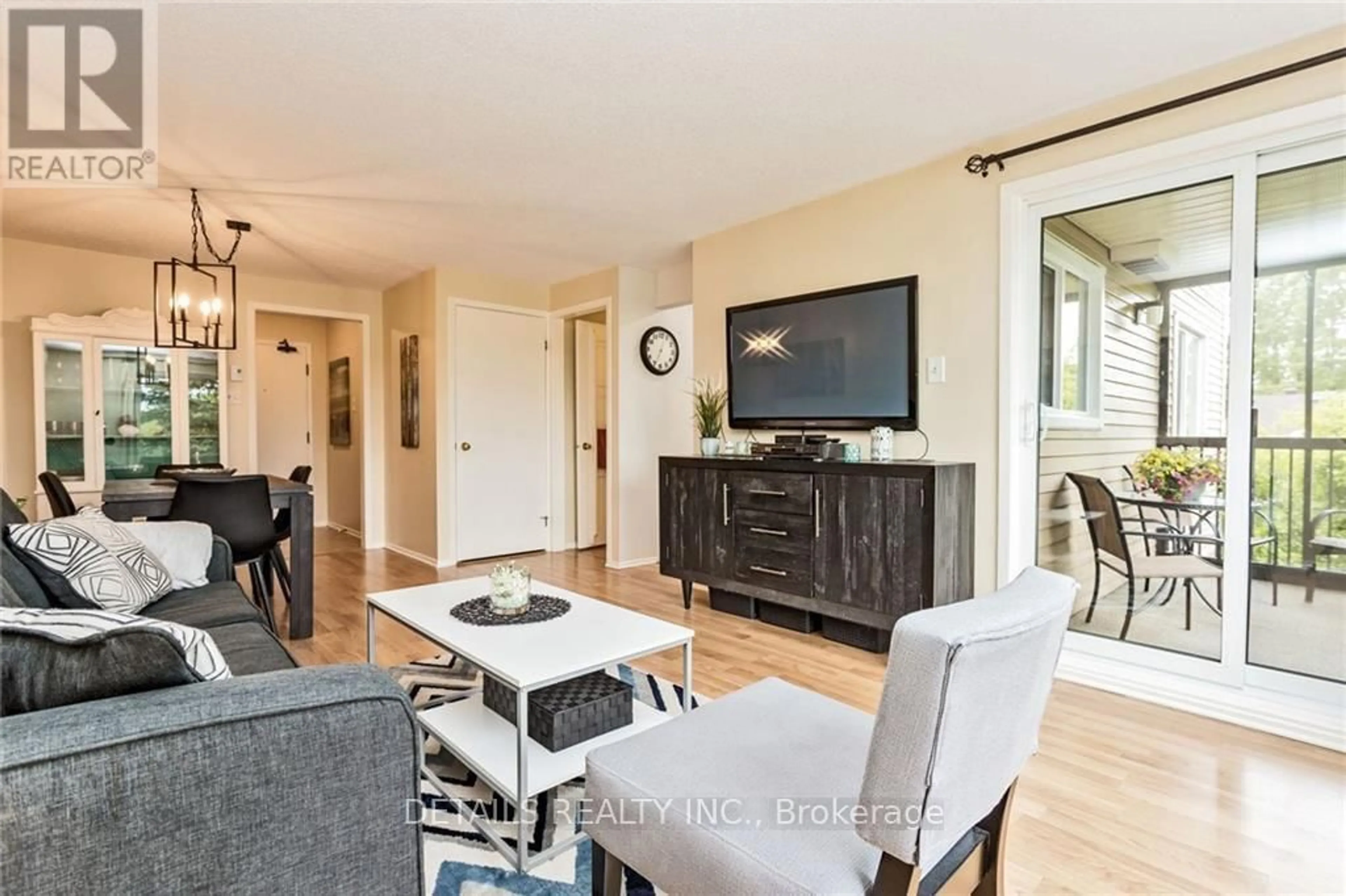 Living room with furniture, wood/laminate floor for 6376 Bilberry Dr #304, Ottawa Ontario K1C 4P6