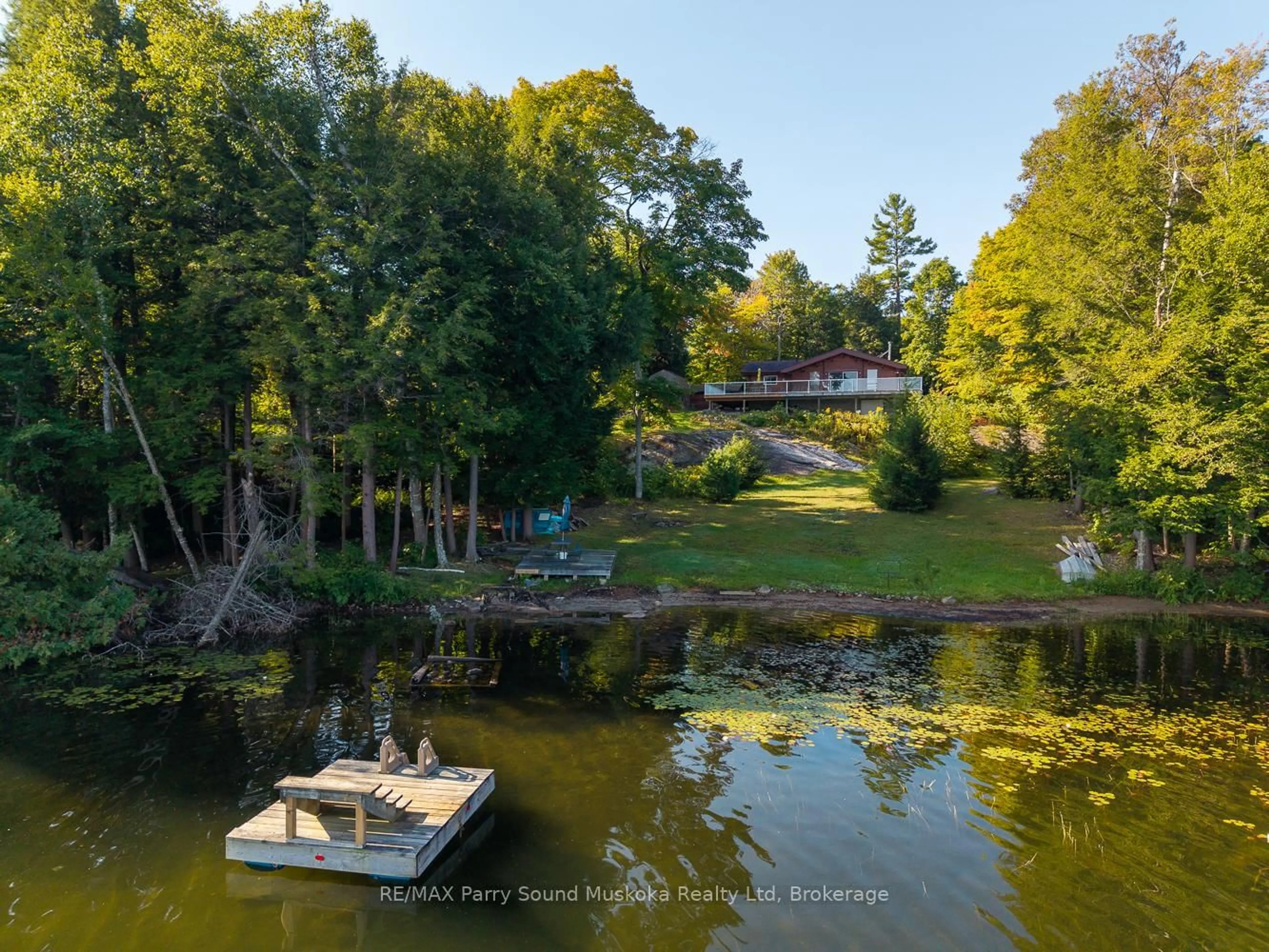 A pic from outside/outdoor area/front of a property/back of a property/a pic from drone, water/lake/river/ocean view for 30 Old Sids Rd, Seguin Ontario P2A 2W8