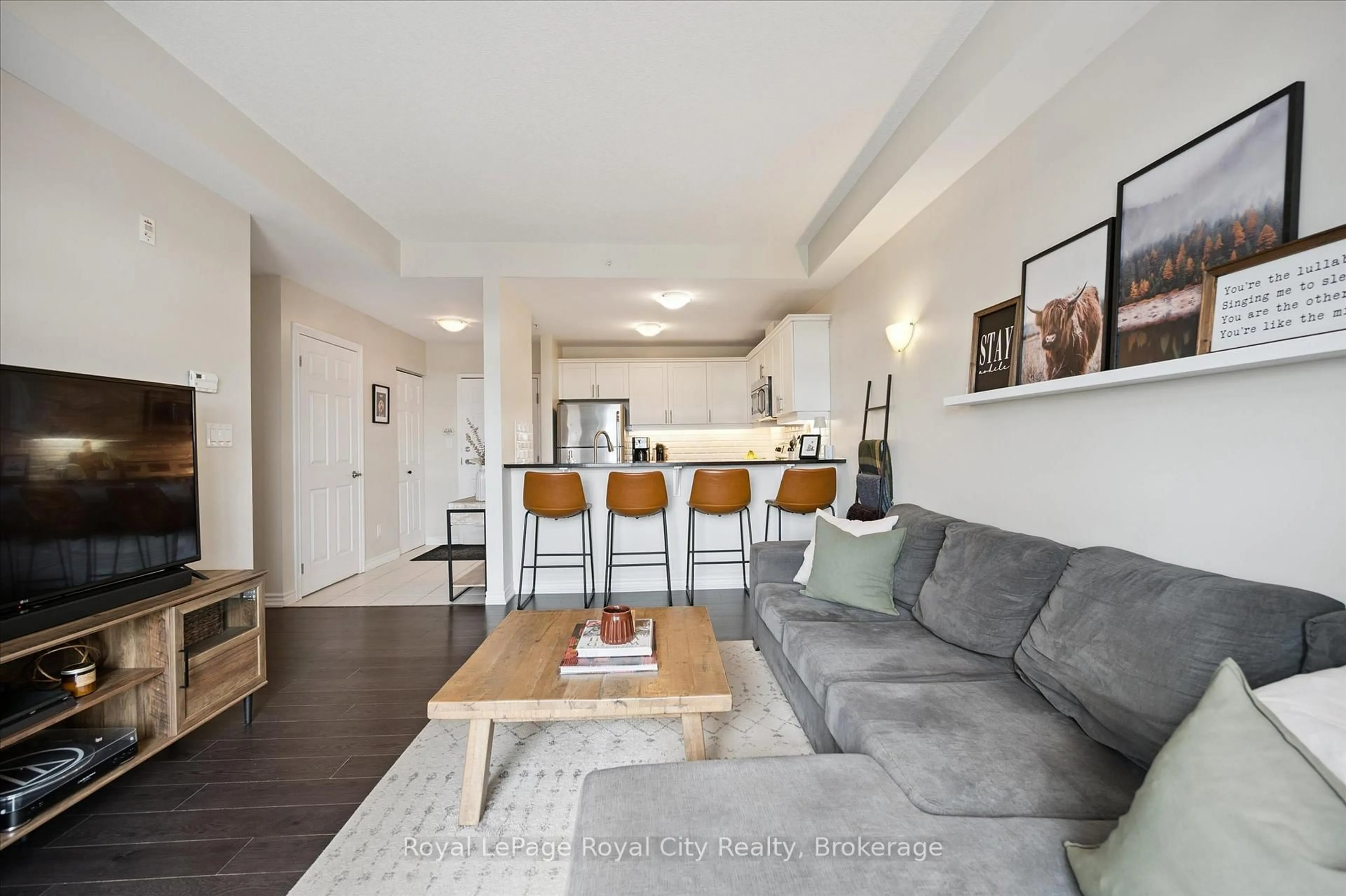 Living room with furniture, wood/laminate floor for 2 Colonial Dr #403, Guelph Ontario N1L 0K8