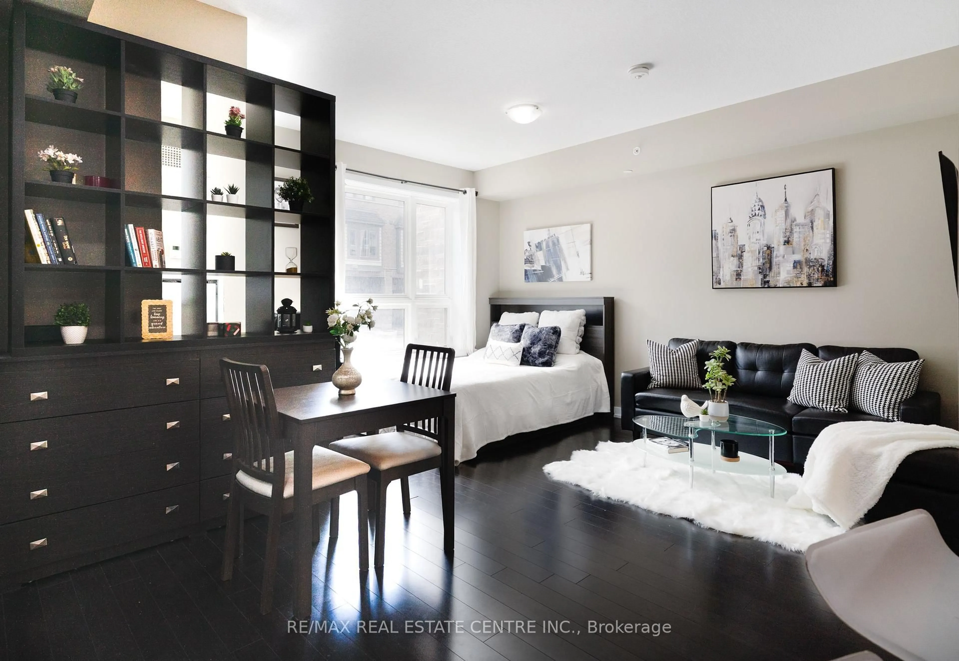 Living room with furniture, wood/laminate floor for 35 Southshore Cres #114, Hamilton Ontario L8E 0J2