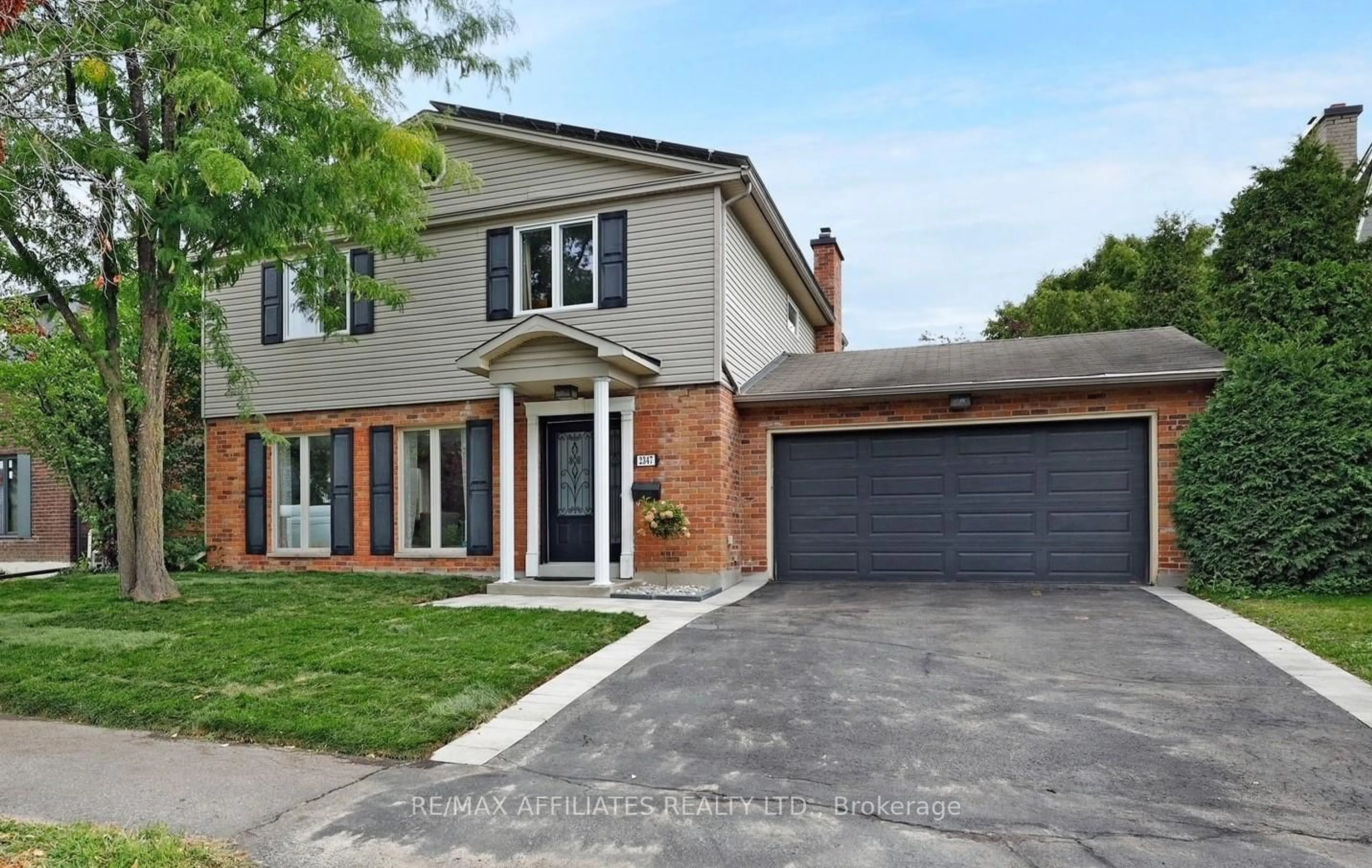 Home with brick exterior material, street for 2347 Briar Hill Dr, Ottawa Ontario K1H 7A7