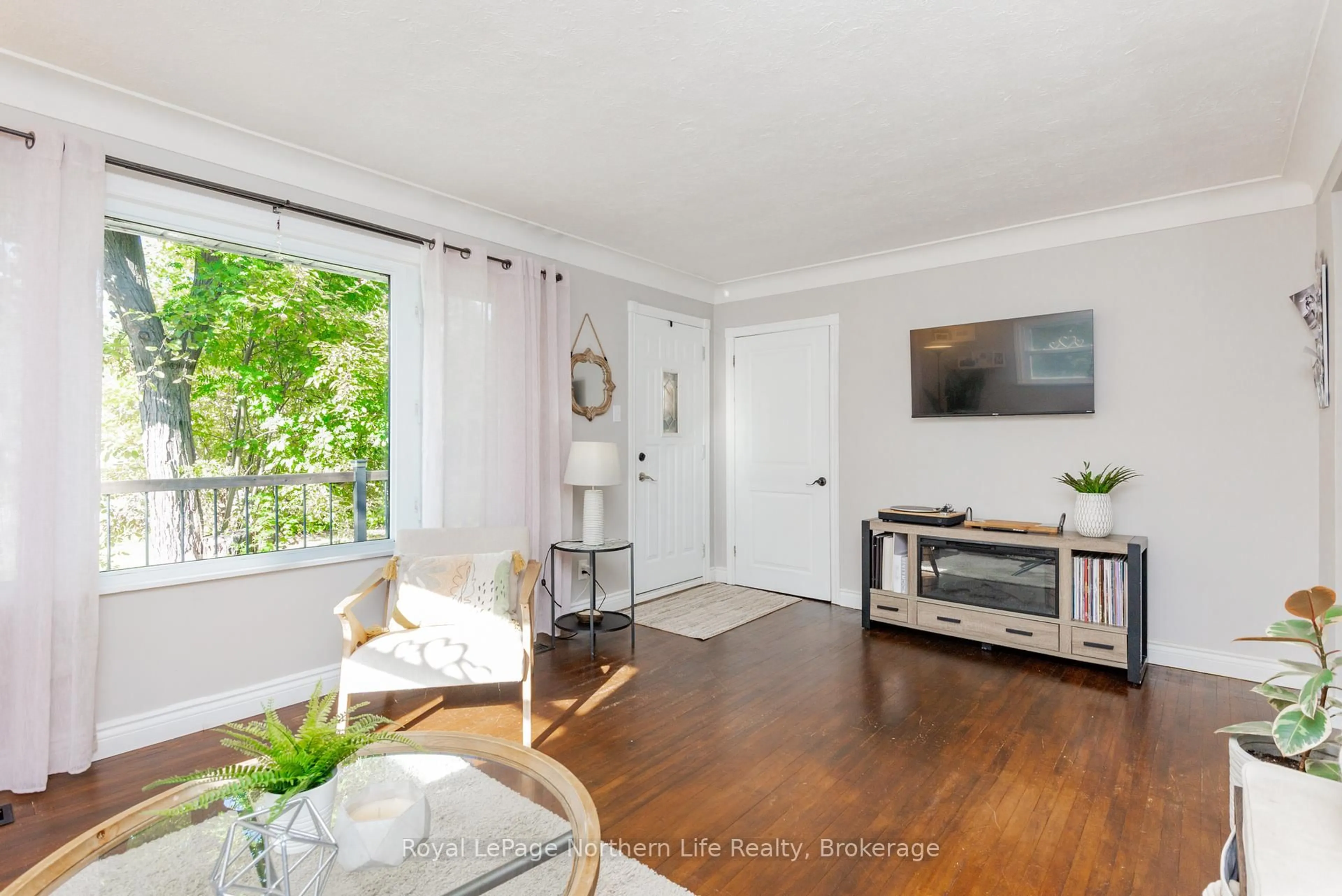 Living room with furniture, wood/laminate floor for 737 Reynolds St, North Bay Ontario P1B 5C5
