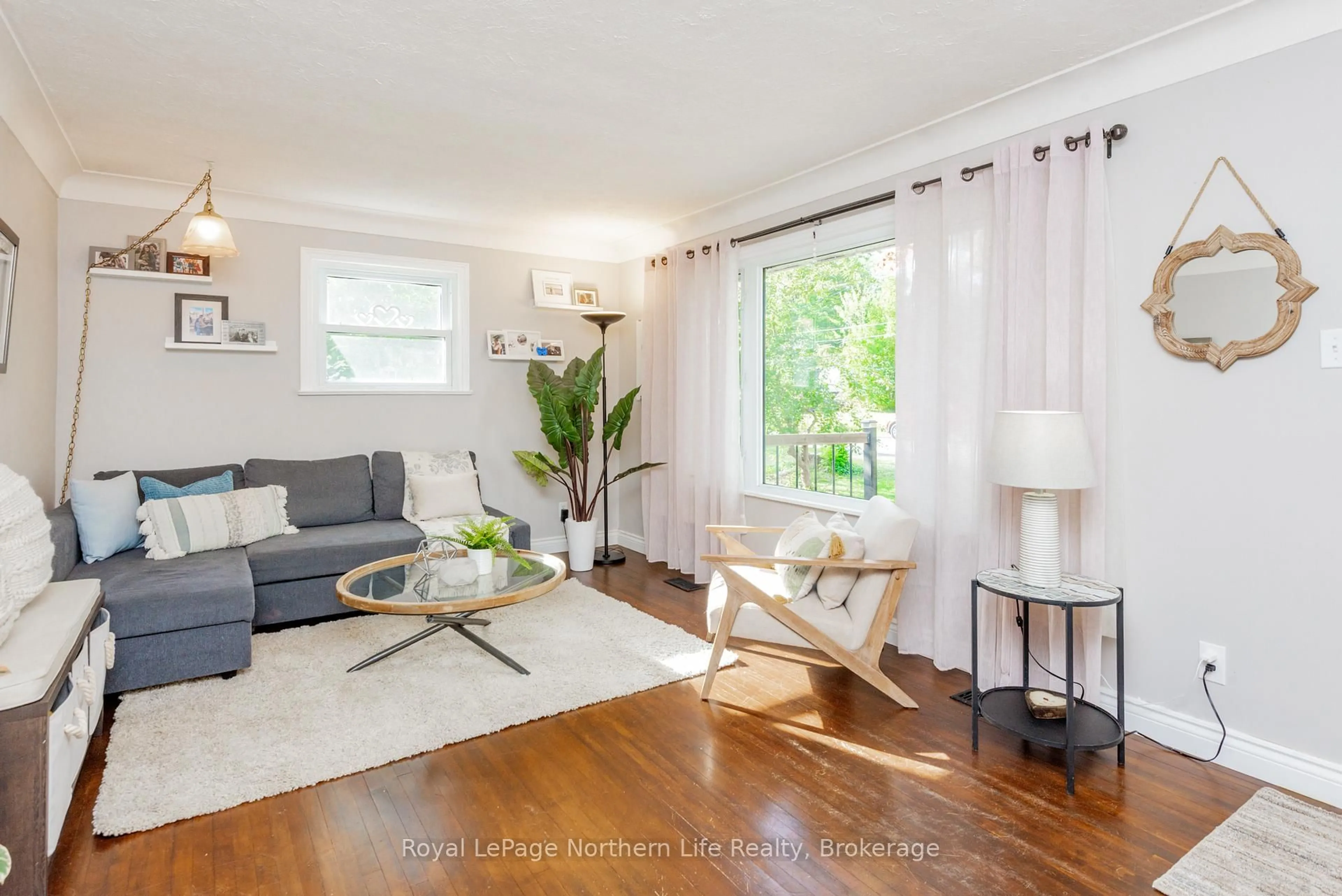 Living room with furniture, wood/laminate floor for 737 Reynolds St, North Bay Ontario P1B 5C5