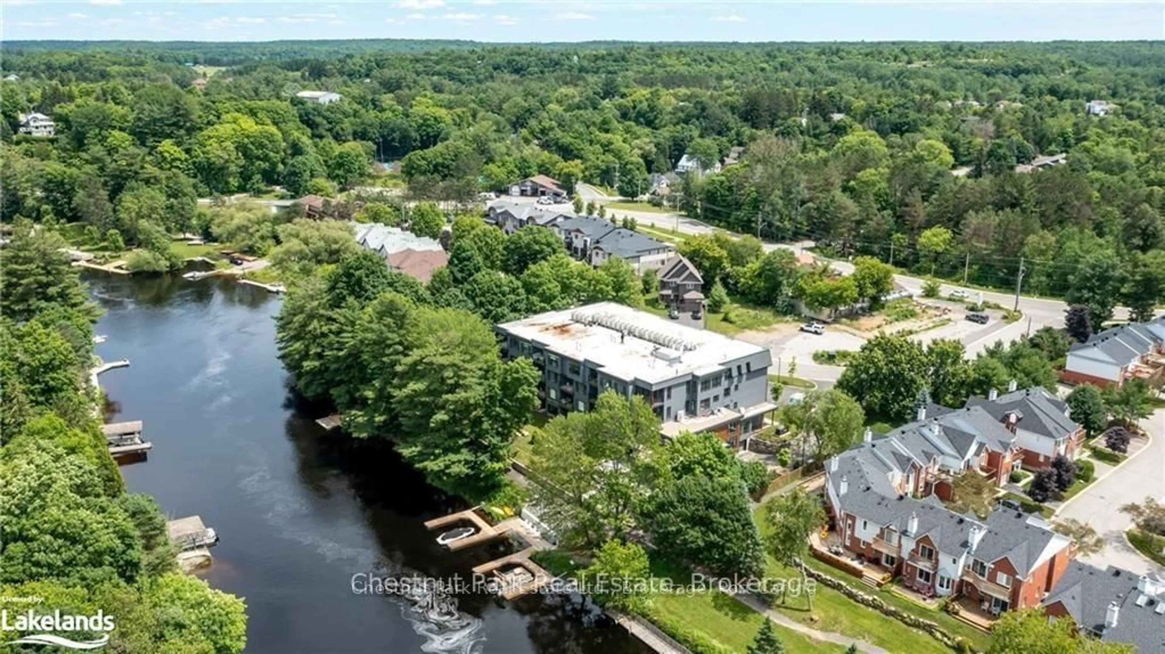 A pic from outside/outdoor area/front of a property/back of a property/a pic from drone, water/lake/river/ocean view for 200 ANGLO St #304, Bracebridge Ontario P1L 1G4
