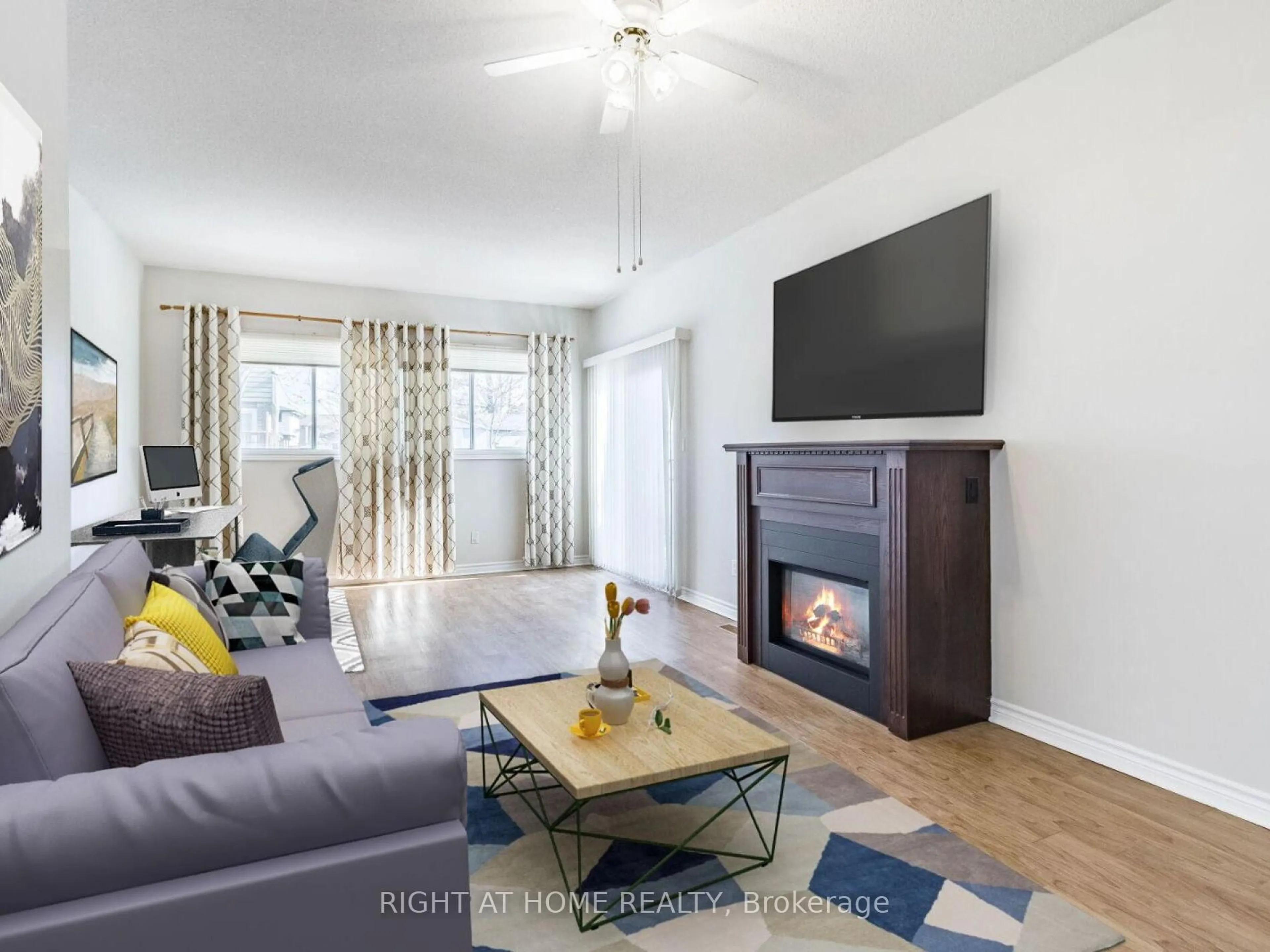 Living room with furniture, wood/laminate floor for 24 The Meadows St, St. Catharines Ontario L2N 7L1
