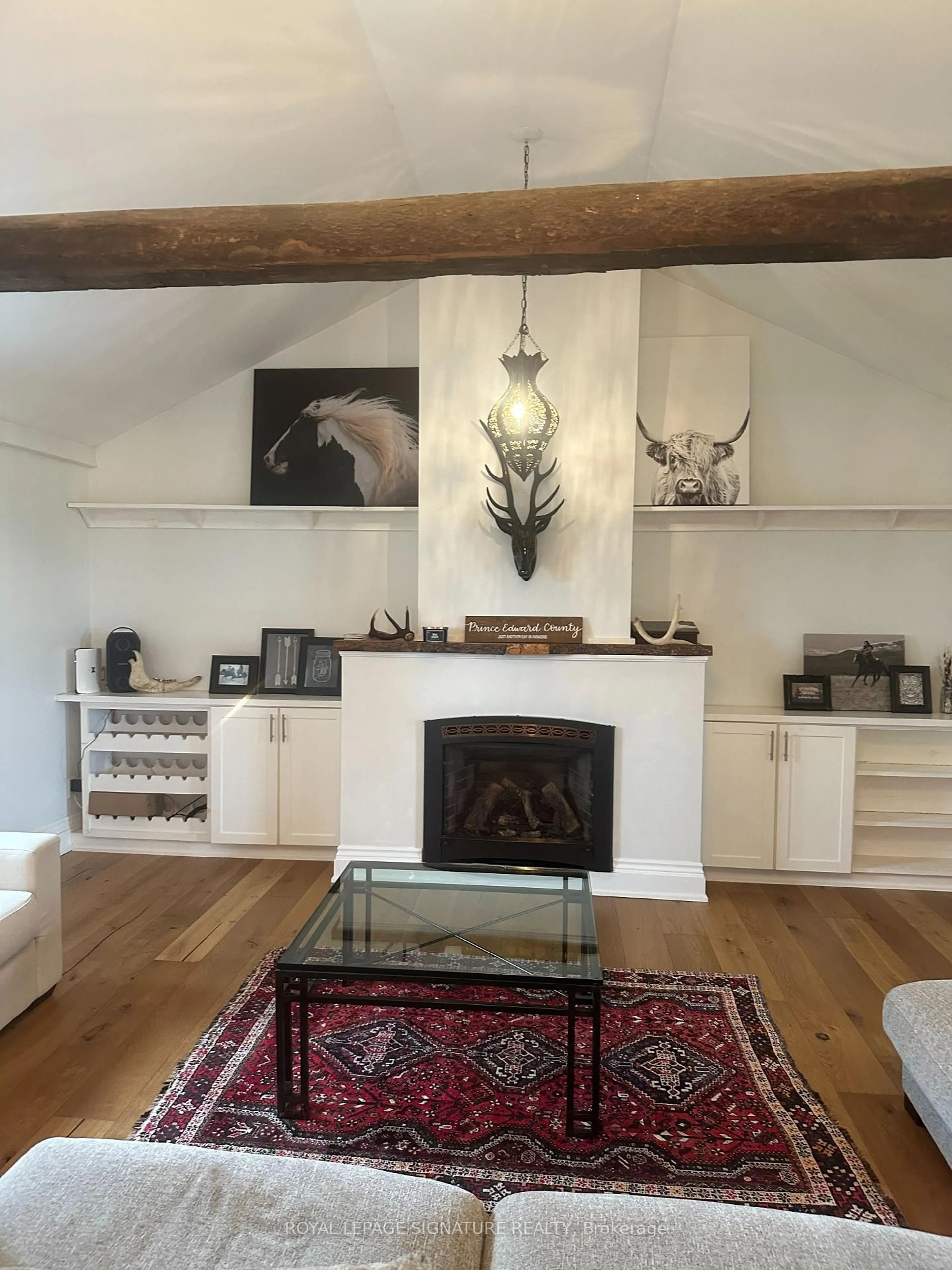 Living room with furniture, wood/laminate floor for 217 Greer Rd, Prince Edward County Ontario K0K 3L0