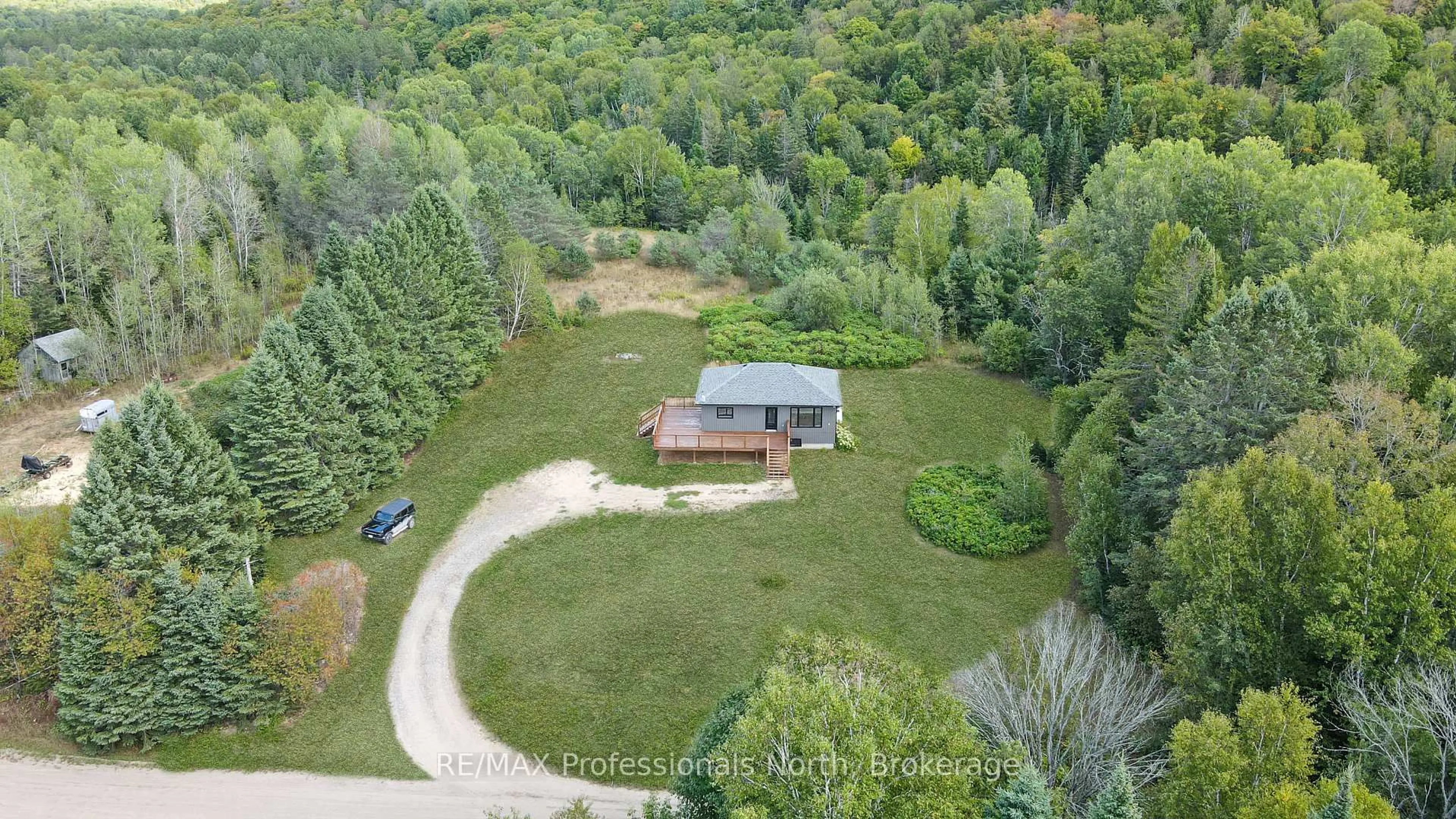 A pic from outside/outdoor area/front of a property/back of a property/a pic from drone, forest/trees view for 1130 Saunders Rd, Highlands East Ontario K0L 3C0