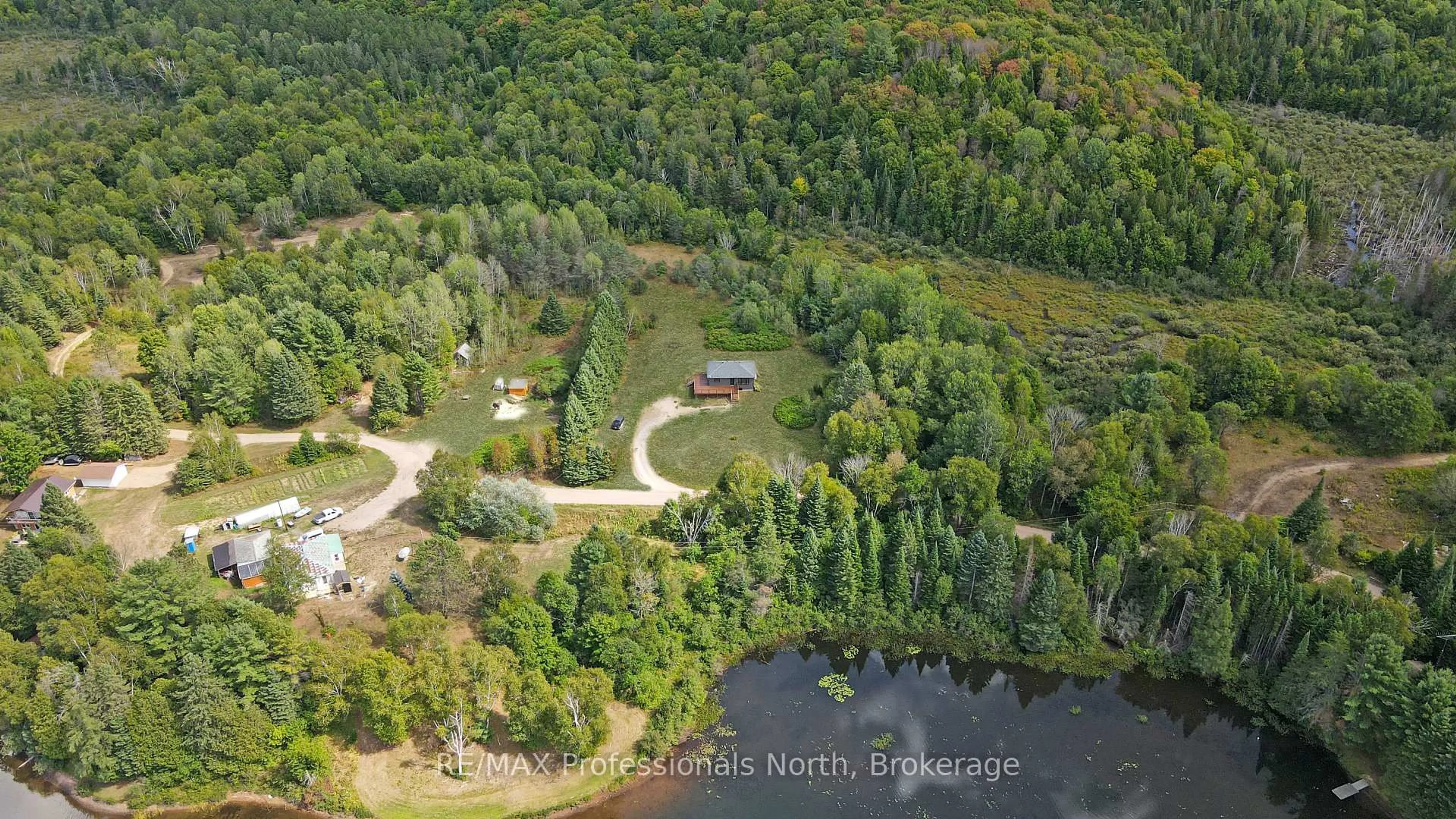 A pic from outside/outdoor area/front of a property/back of a property/a pic from drone, water/lake/river/ocean view for 1130 Saunders Rd, Highlands East Ontario K0L 3C0