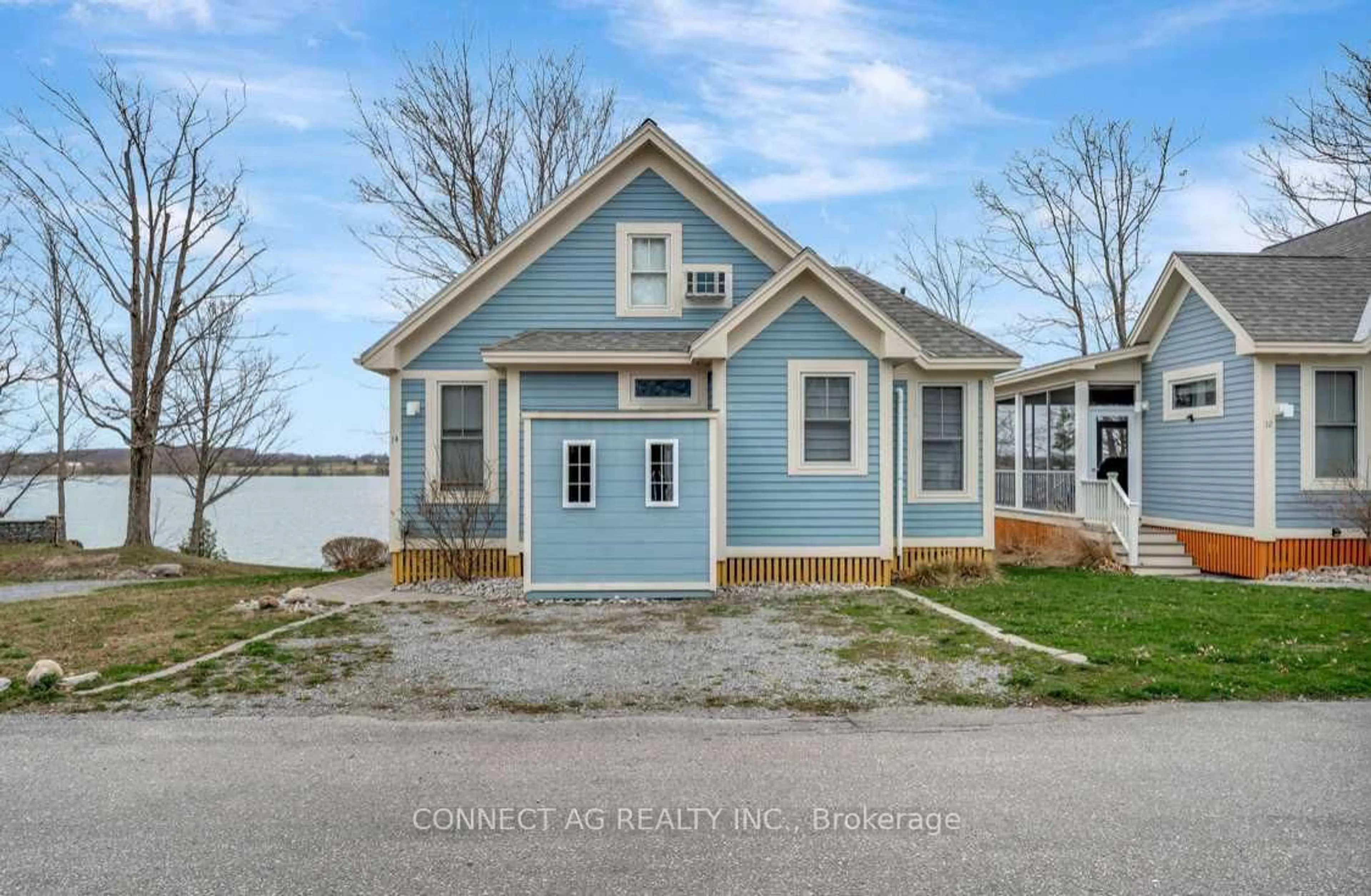 Home with vinyl exterior material, street for 14 Summer Village Lane #164, Prince Edward County Ontario K0K 1P0
