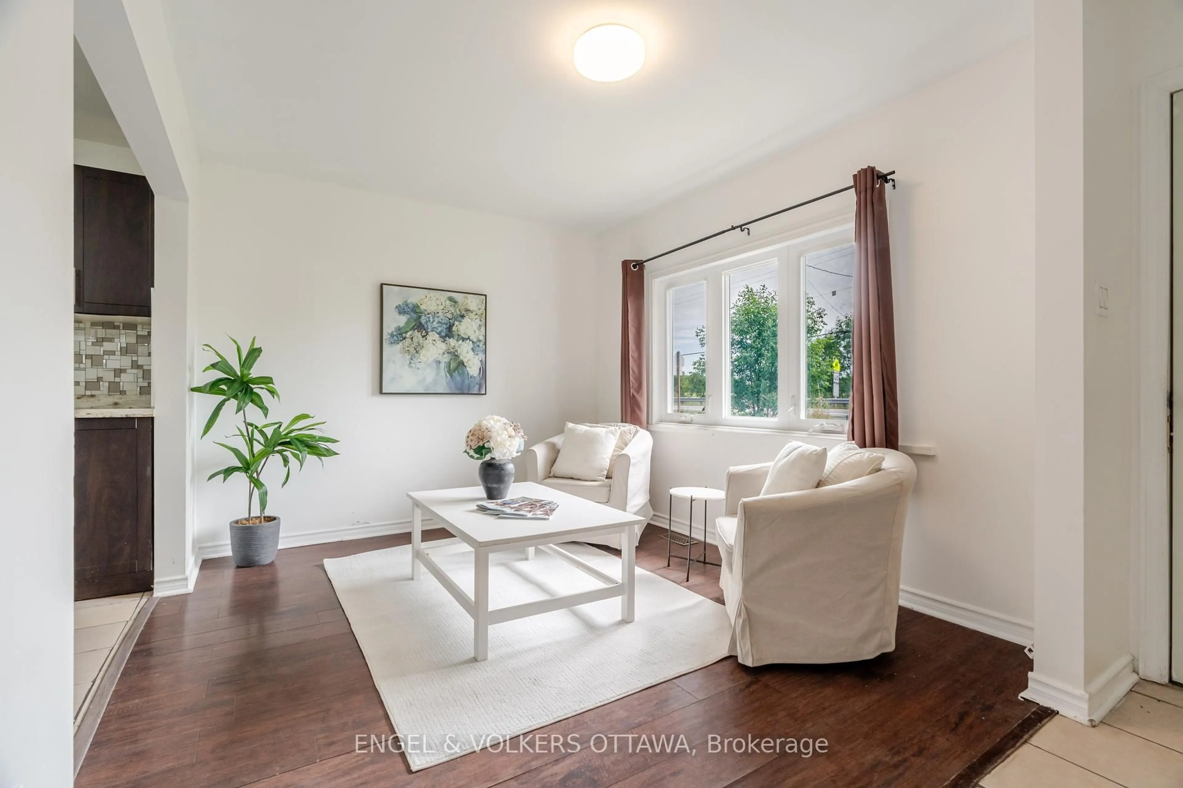 Living room with furniture, wood/laminate floor for 7321 Snake Island Rd, Greely Ontario K4P 1N2