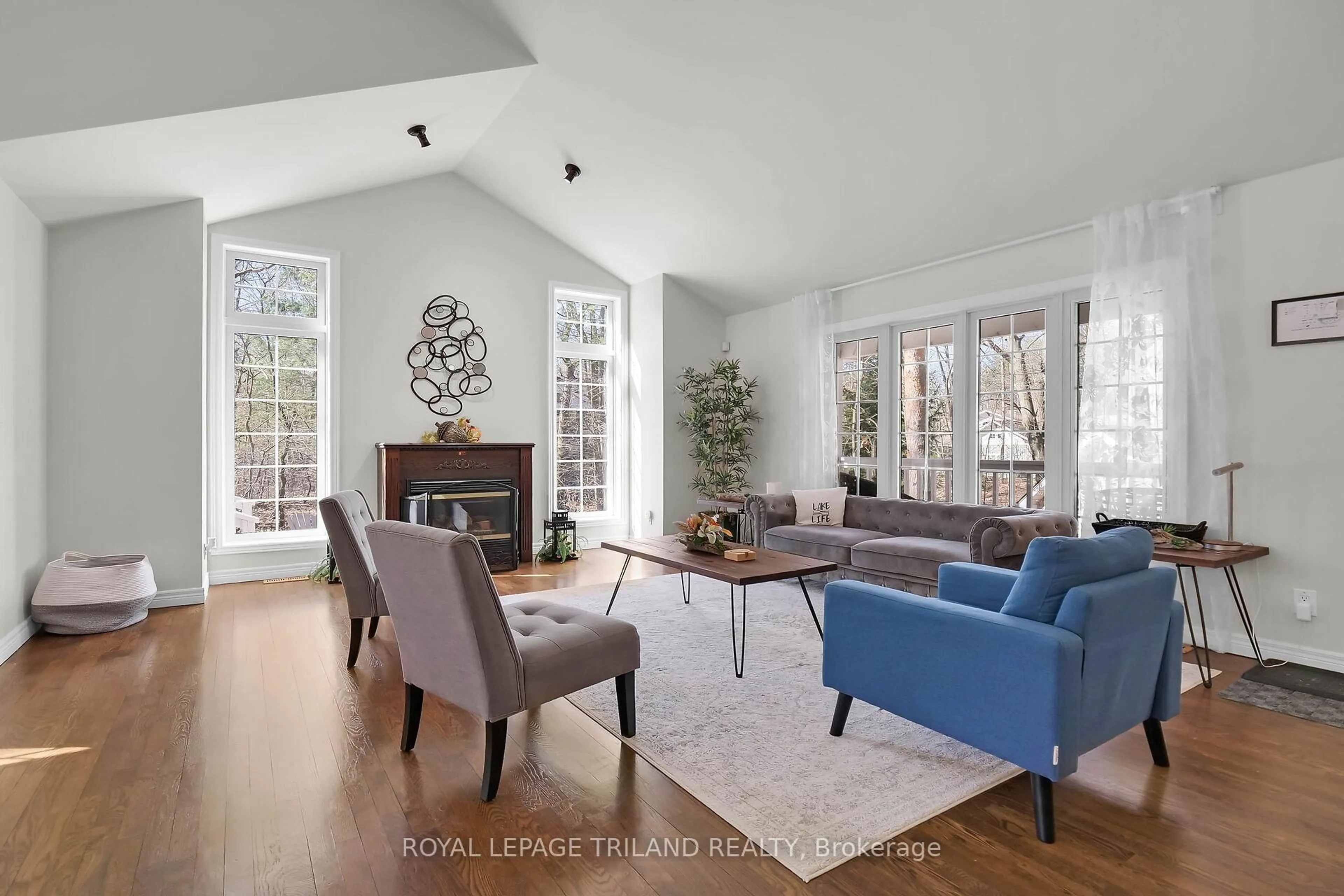 Living room with furniture, wood/laminate floor for 9945 RIVERVIEW Rd, Lambton Shores Ontario N0M 1T0