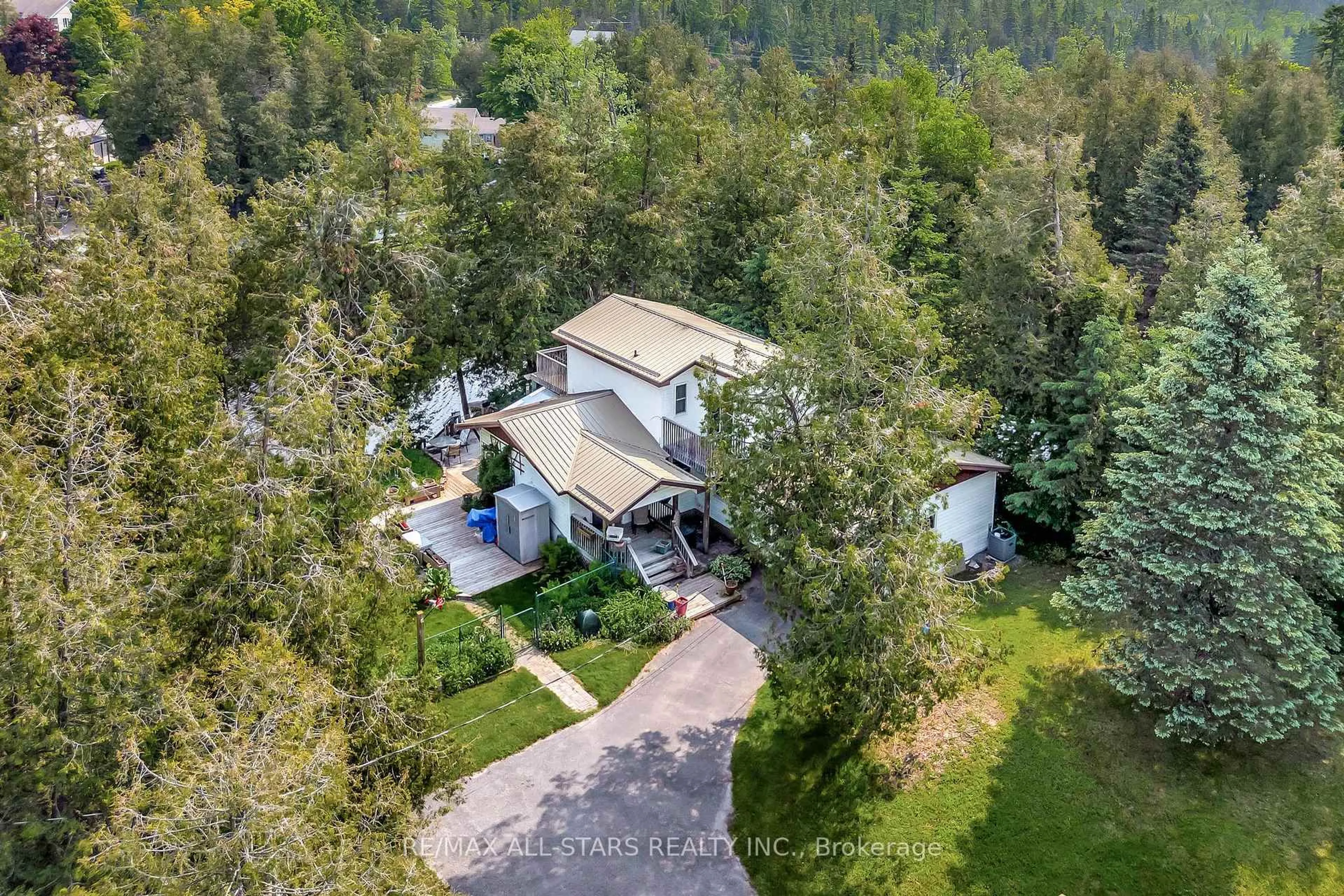 A pic from outside/outdoor area/front of a property/back of a property/a pic from drone, unknown for 14 Wychwood Dr, Kawartha Lakes Ontario K0M 1N0