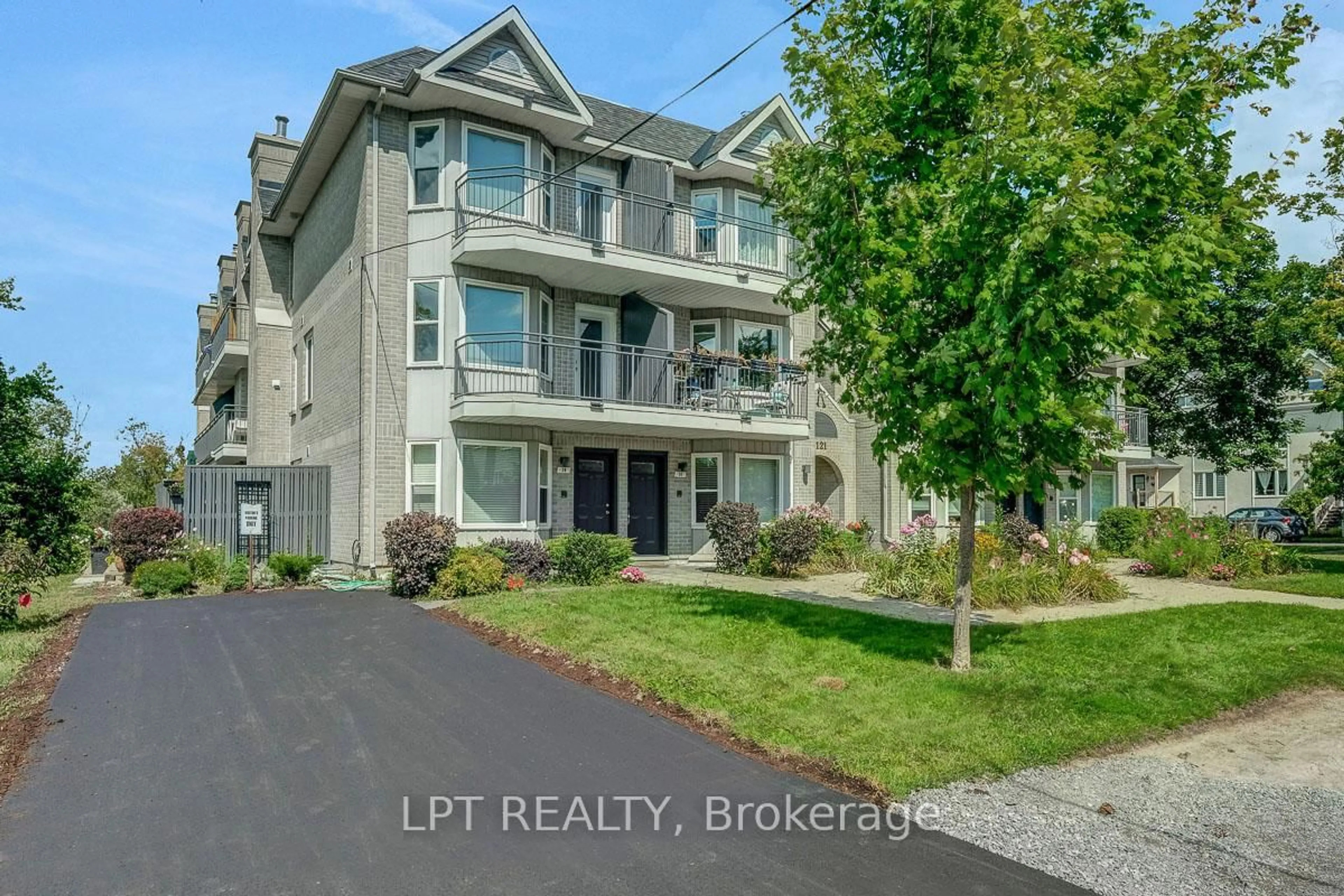 A pic from outside/outdoor area/front of a property/back of a property/a pic from drone, street for 1121 Bavlie Ave #13, Ottawa Ontario K1H 8P3