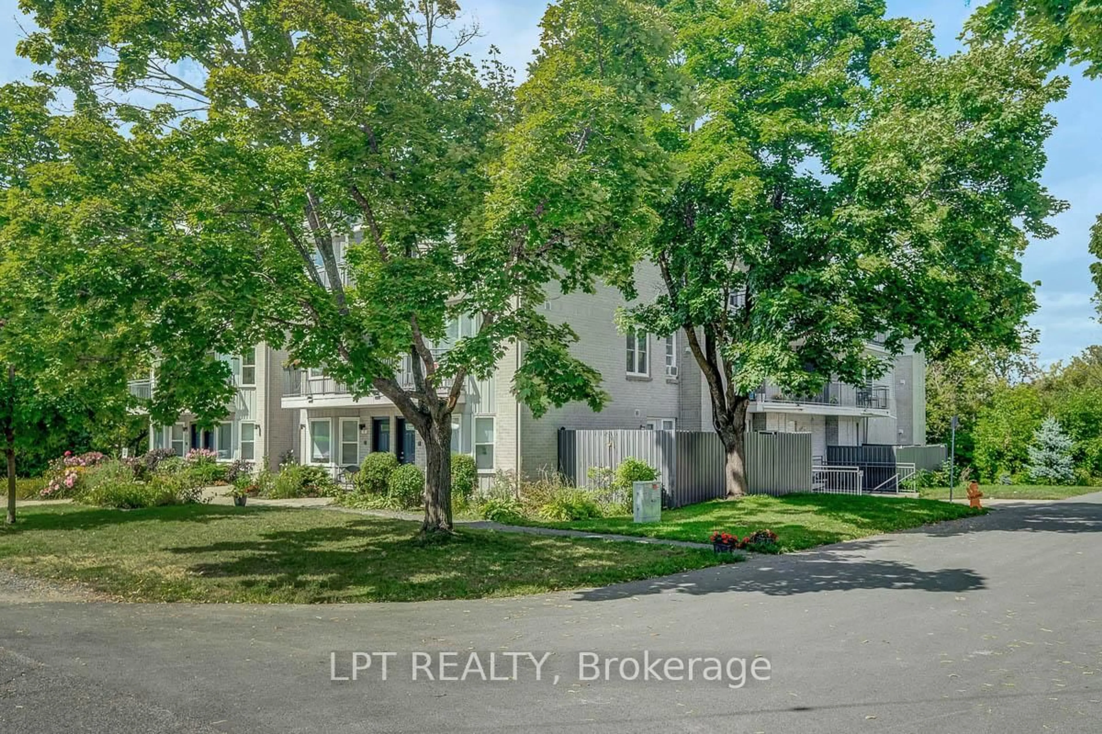 A pic from outside/outdoor area/front of a property/back of a property/a pic from drone, street for 1121 Bavlie Ave #13, Ottawa Ontario K1H 8P3