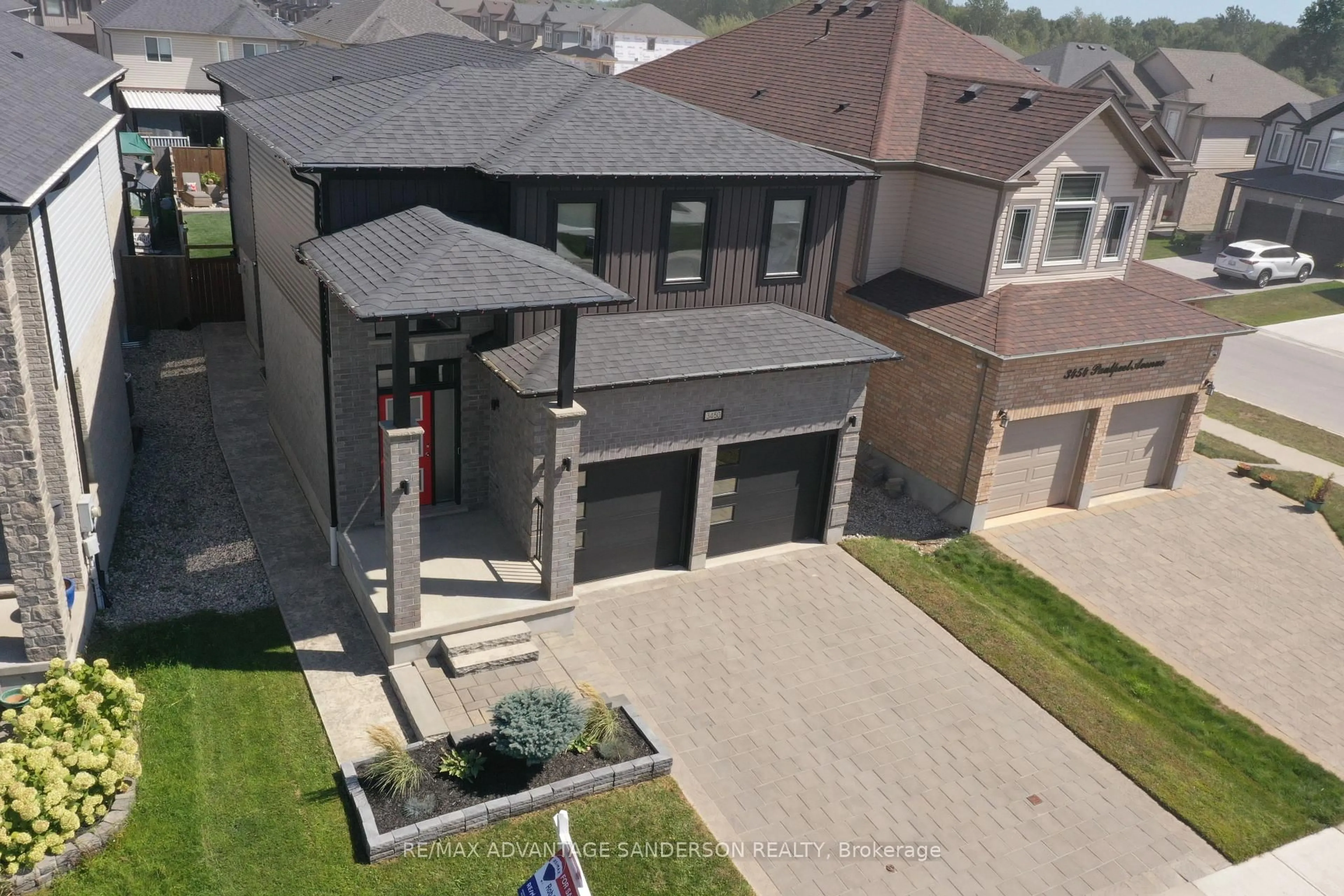 A pic from outside/outdoor area/front of a property/back of a property/a pic from drone, street for 3450 Paulpeel Ave, London South Ontario N6L 0E2