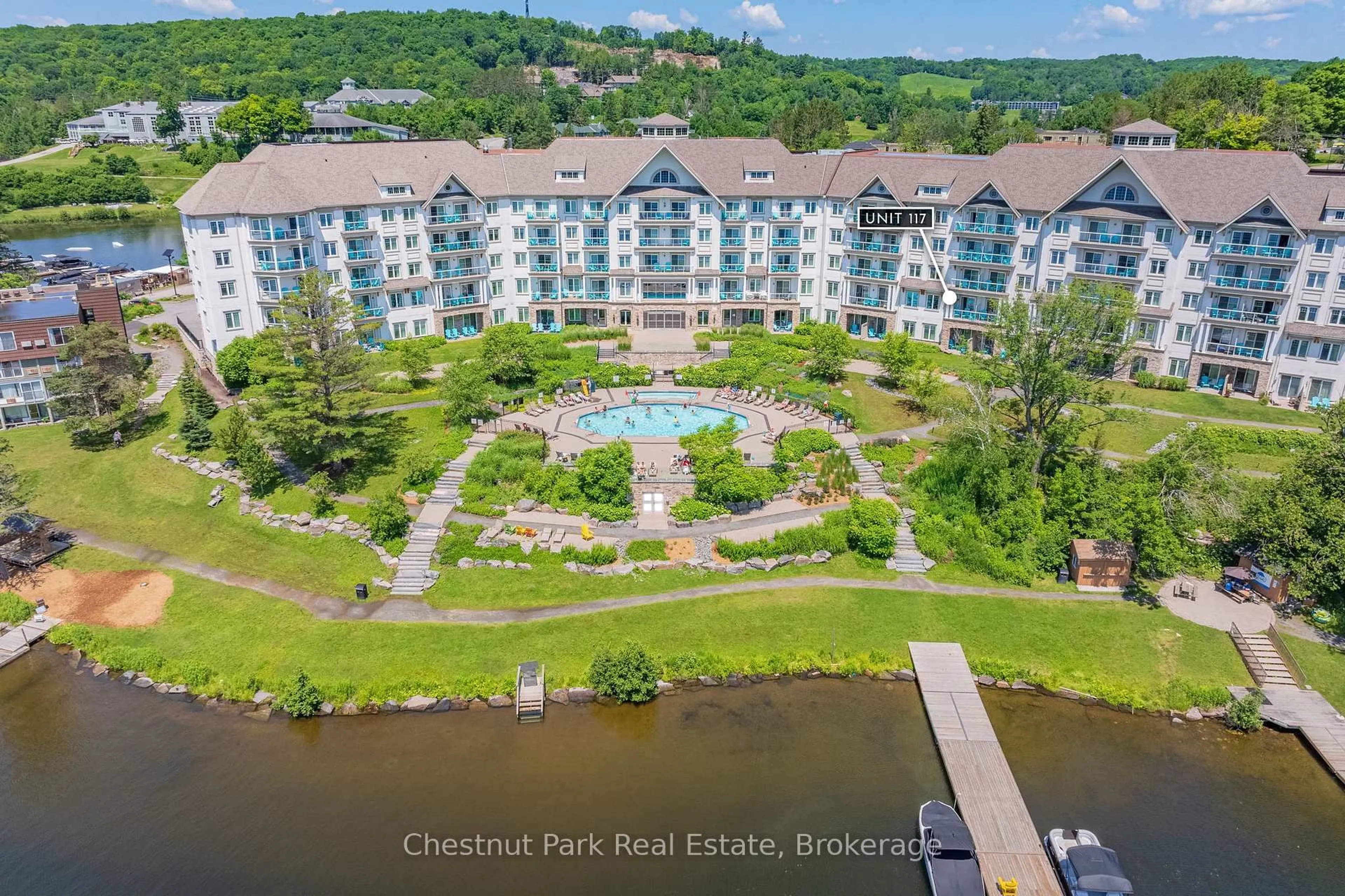 A pic from outside/outdoor area/front of a property/back of a property/a pic from drone, water/lake/river/ocean view for 25 Pen Lake Point Rd #117, Huntsville Ontario P1H 1A9