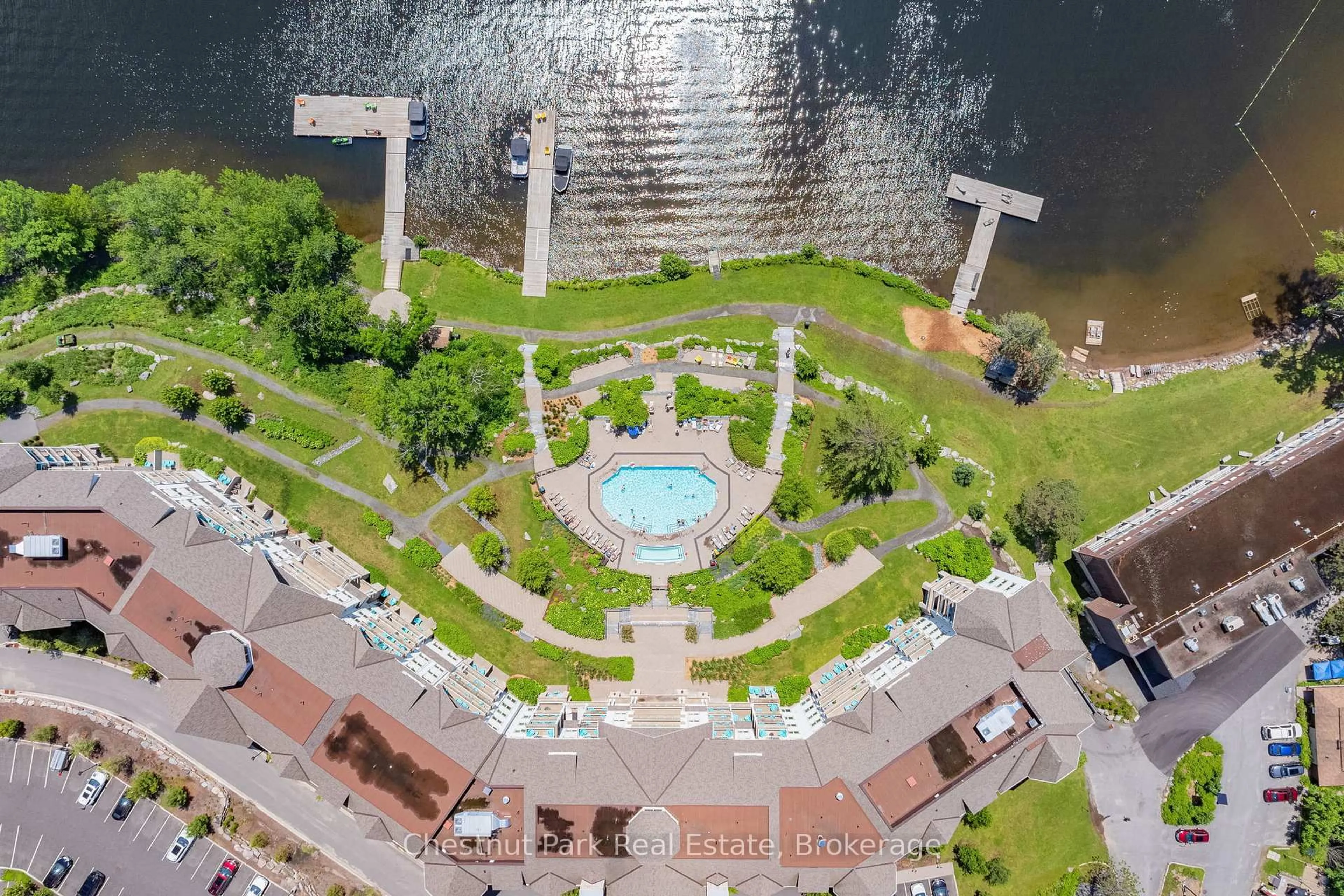 A pic from outside/outdoor area/front of a property/back of a property/a pic from drone, water/lake/river/ocean view for 25 Pen Lake Point Rd #117, Huntsville Ontario P1H 1A9
