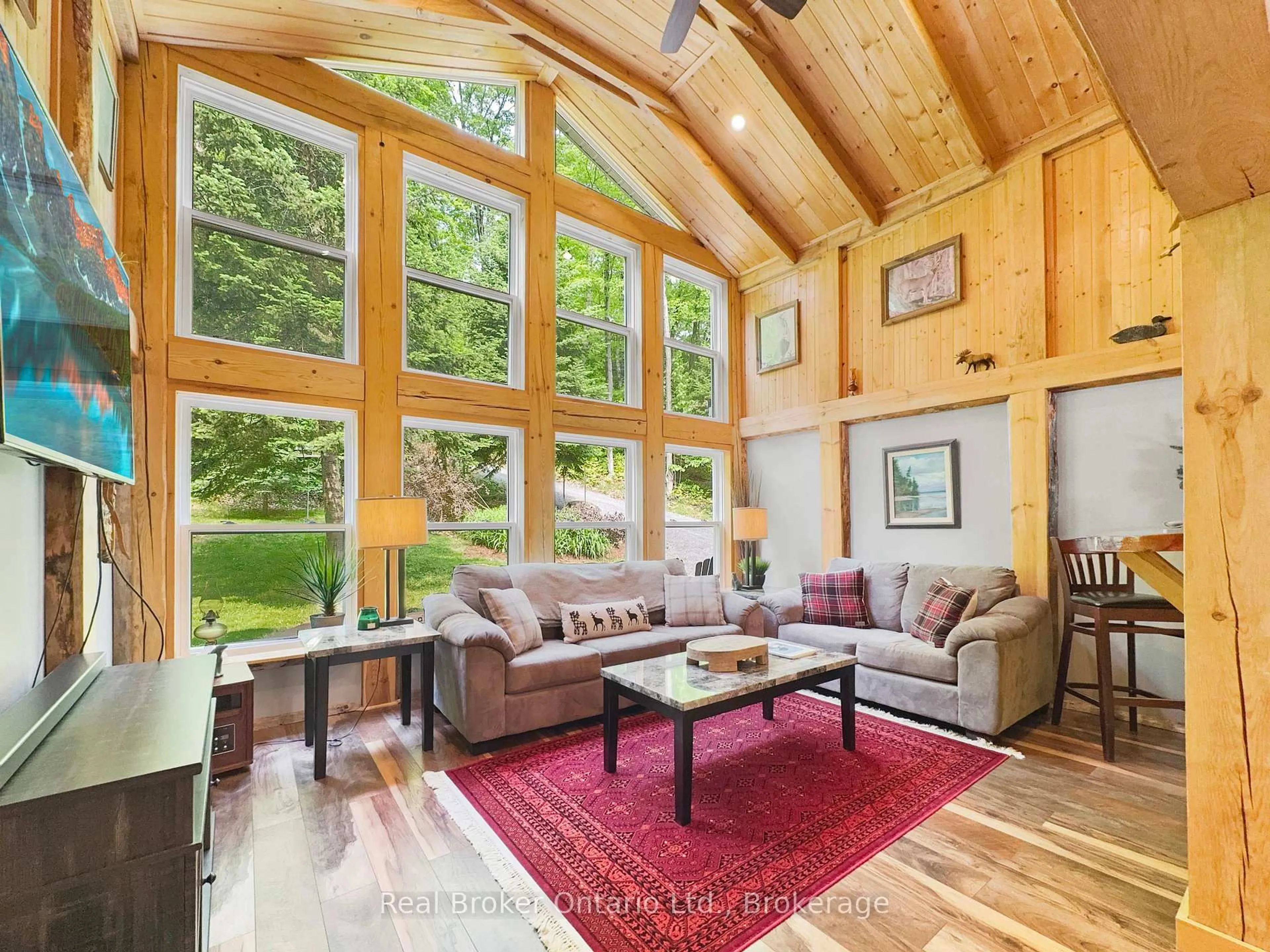 Living room with furniture, wood/laminate floor for 31 Fowke Lake Rd, Parry Sound Remote Area Ontario P0A 1X0