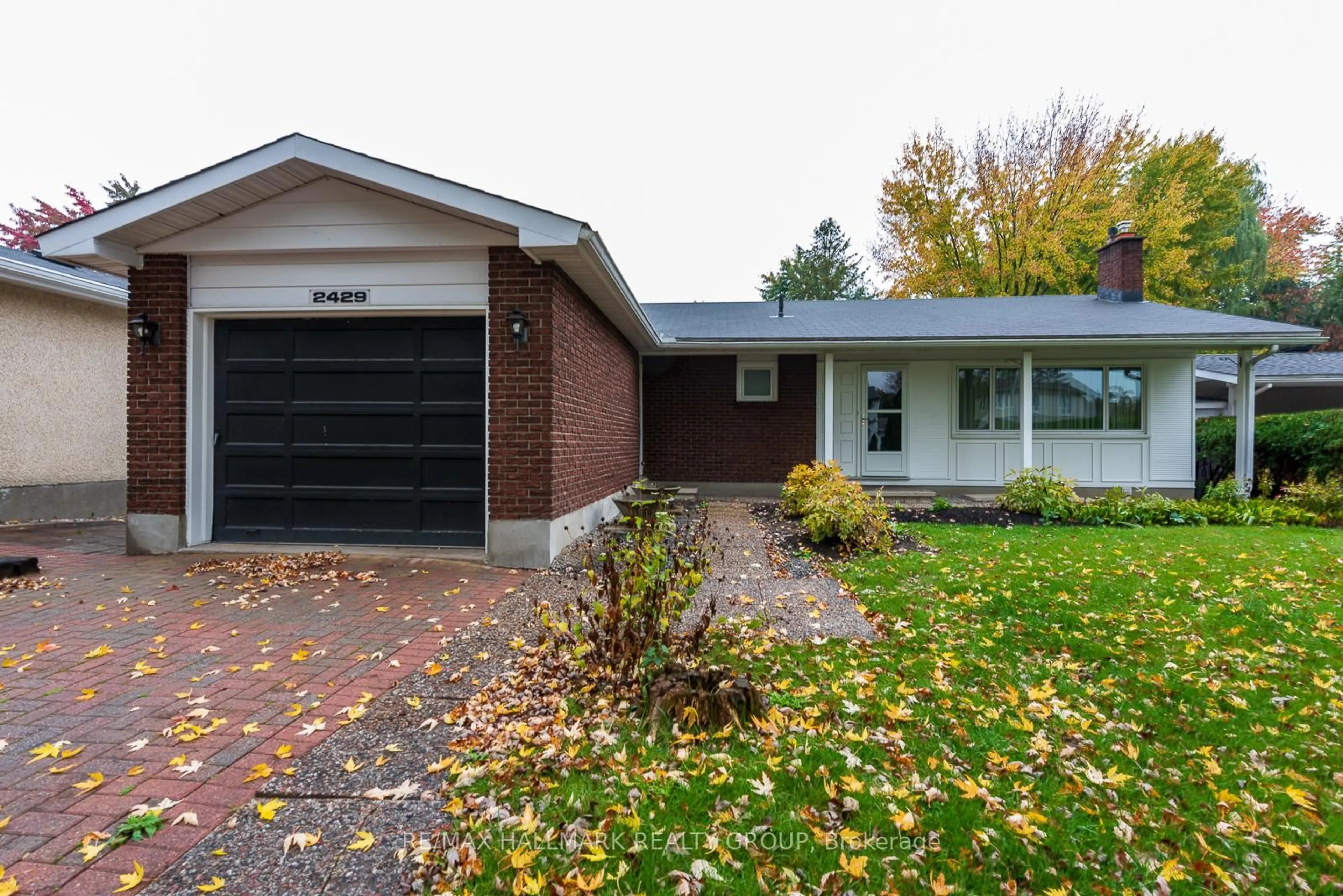 Home with brick exterior material, street for 2429 Ogilvie Rd, Ottawa Ontario K1J 7N3