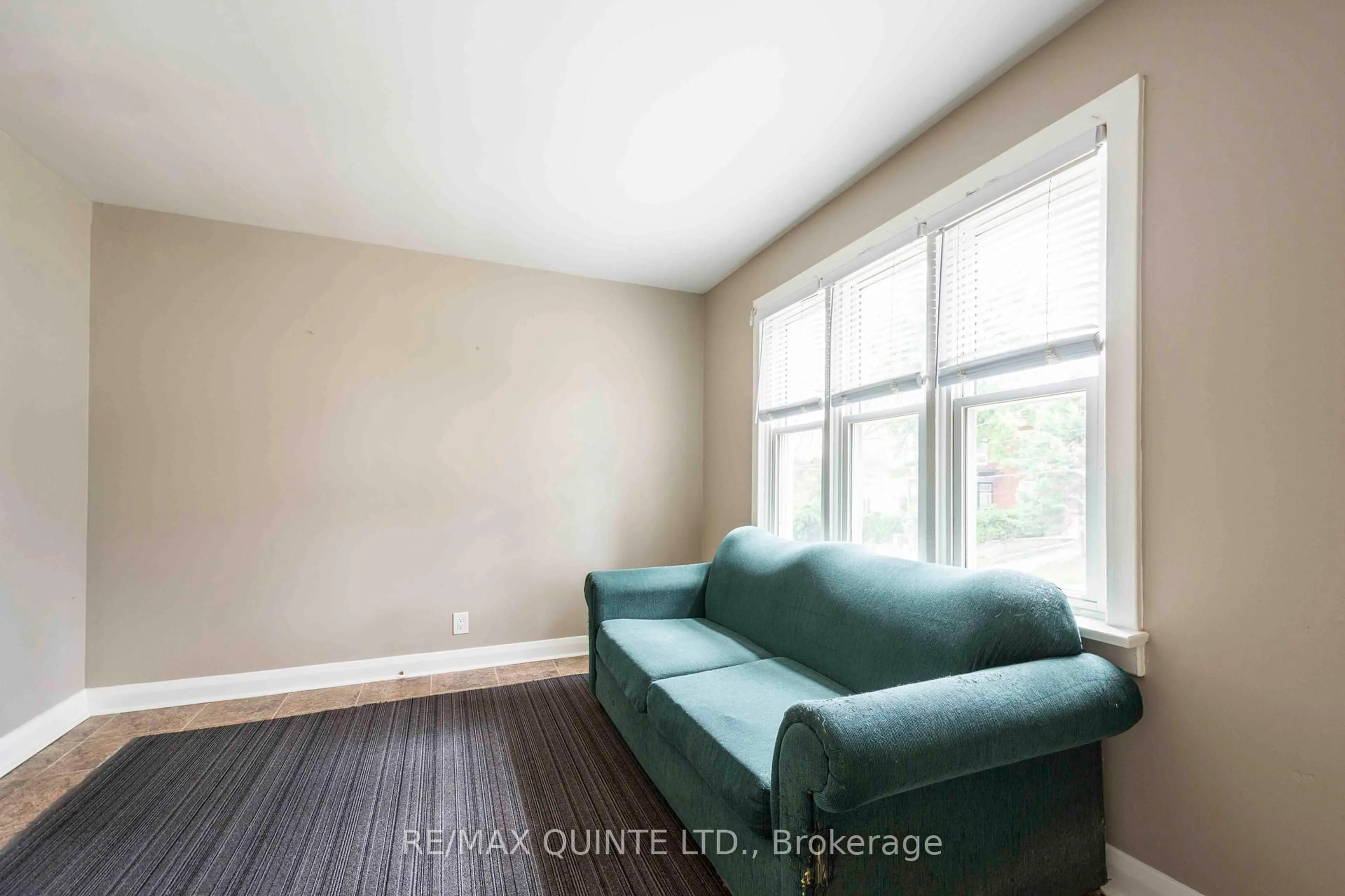 Living room with furniture, wood/laminate floor for 110 Moira St, Belleville Ontario K8P 1S9
