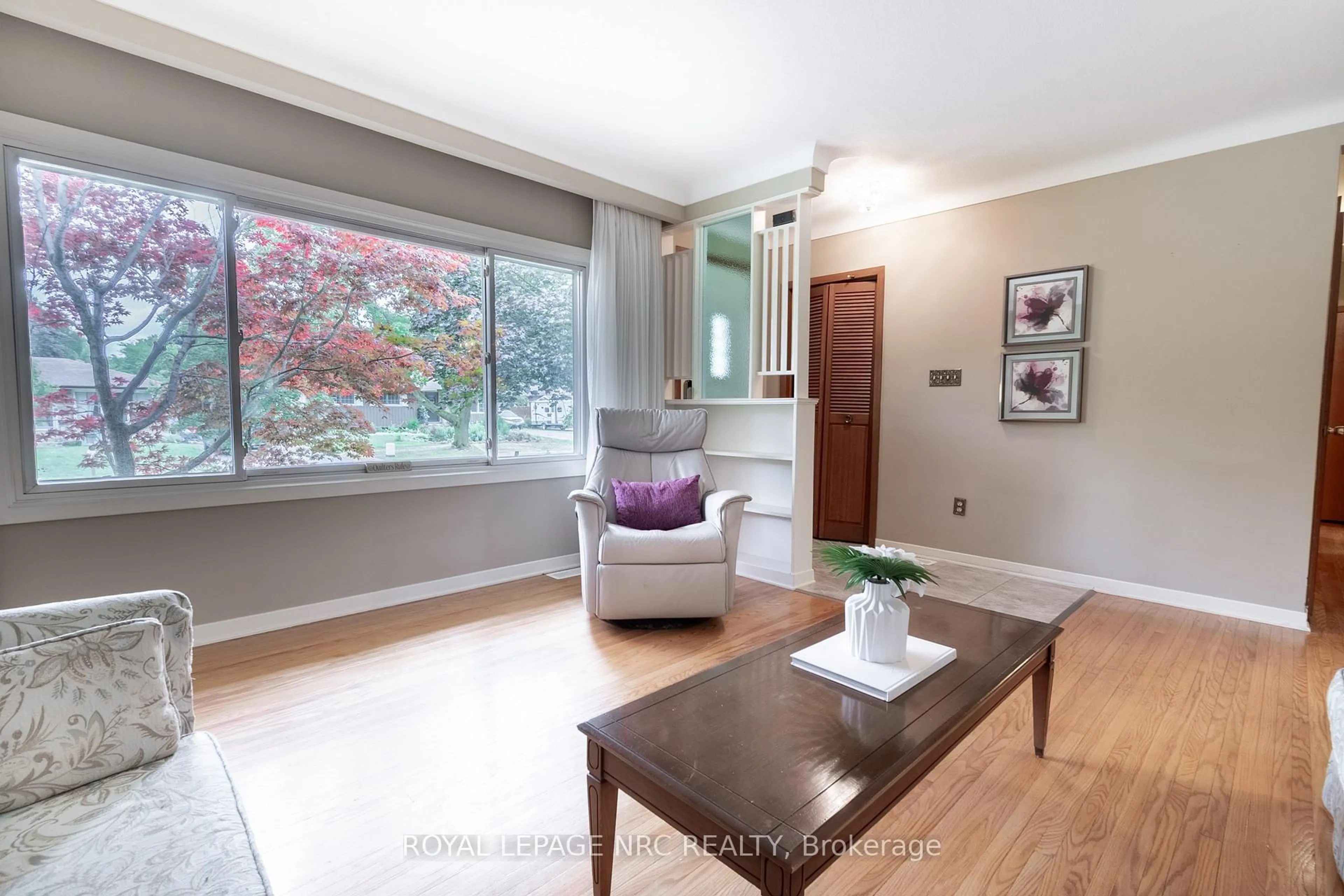 Living room with furniture, wood/laminate floor for 15 Monique Cres, St. Catharines Ontario L2M 1S8