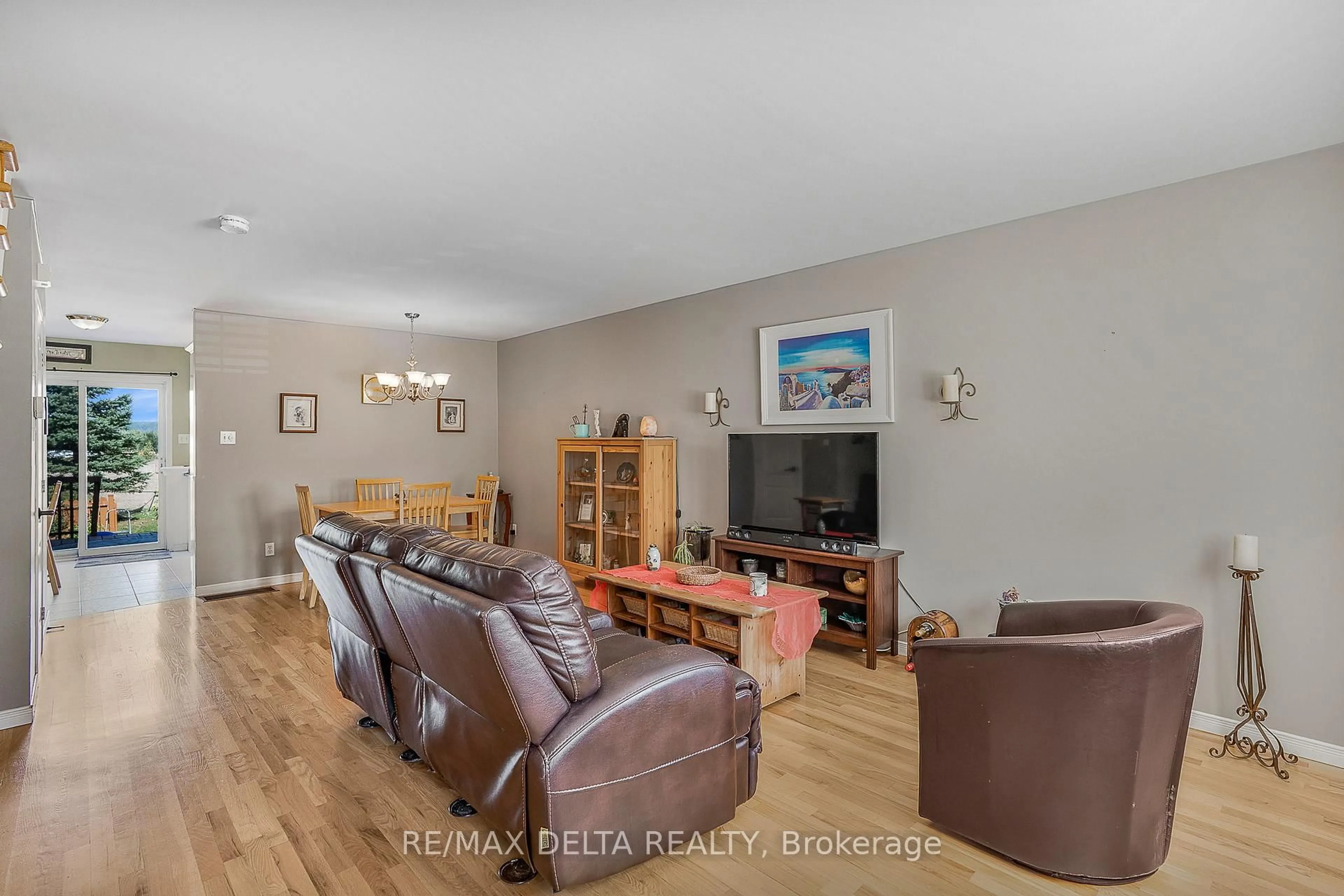 Living room with furniture, wood/laminate floor for 843 Nelson St, Hawkesbury Ontario K6A 3T3