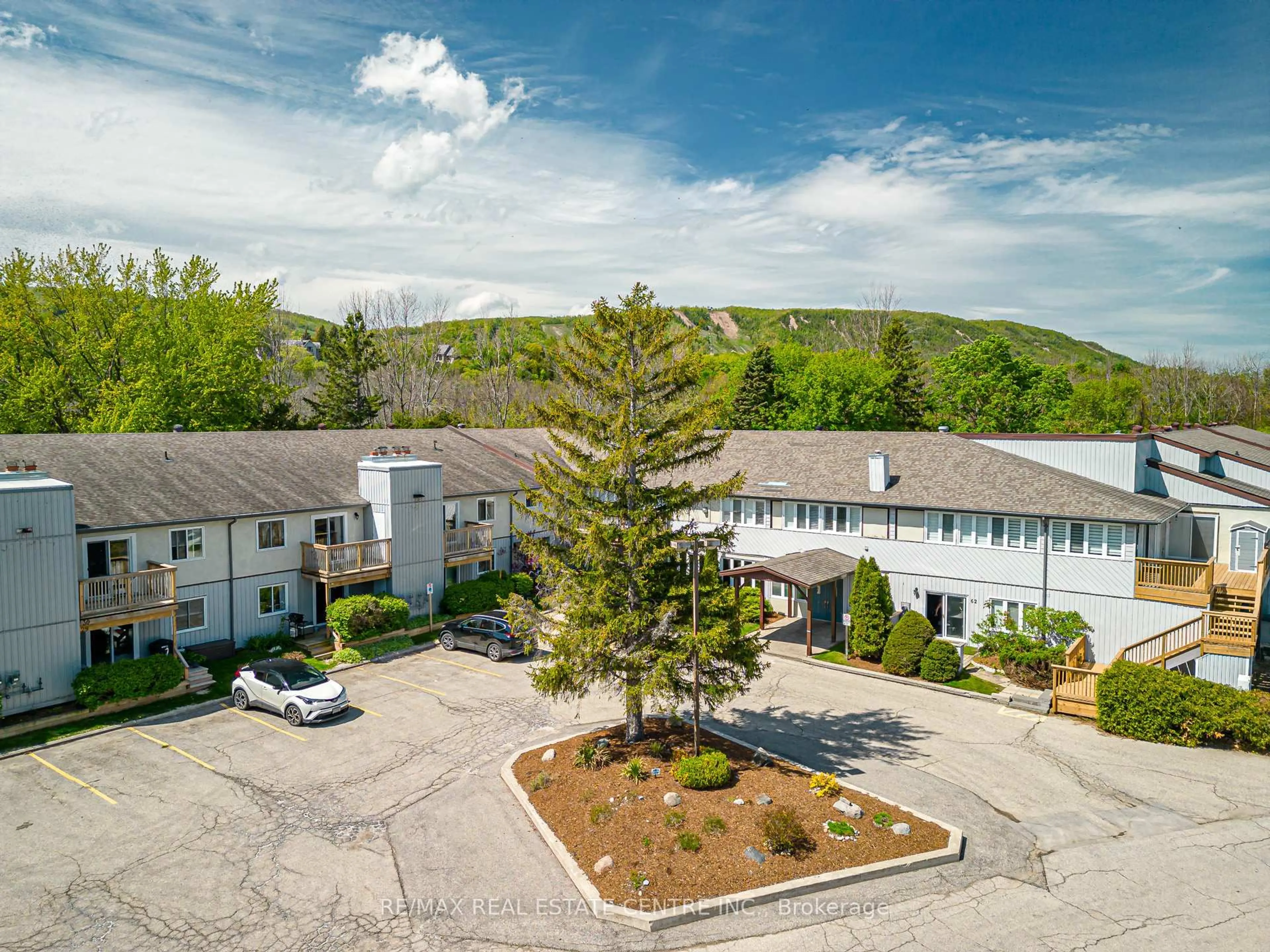 A pic from outside/outdoor area/front of a property/back of a property/a pic from drone, mountain view for 20947 Highway 26 Highway #19, Blue Mountains Ontario L9Y 0V3