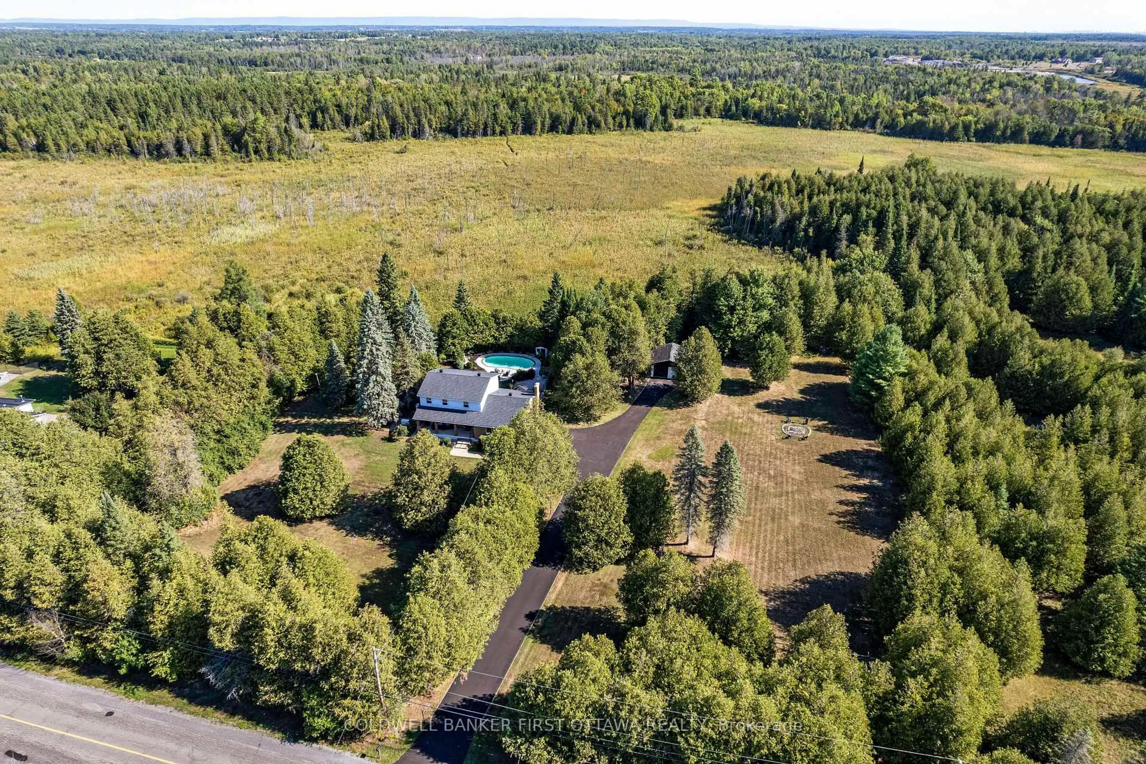 A pic from outside/outdoor area/front of a property/back of a property/a pic from drone, forest/trees view for 1390 Corkery Rd, Carp Ontario K0A 1L0