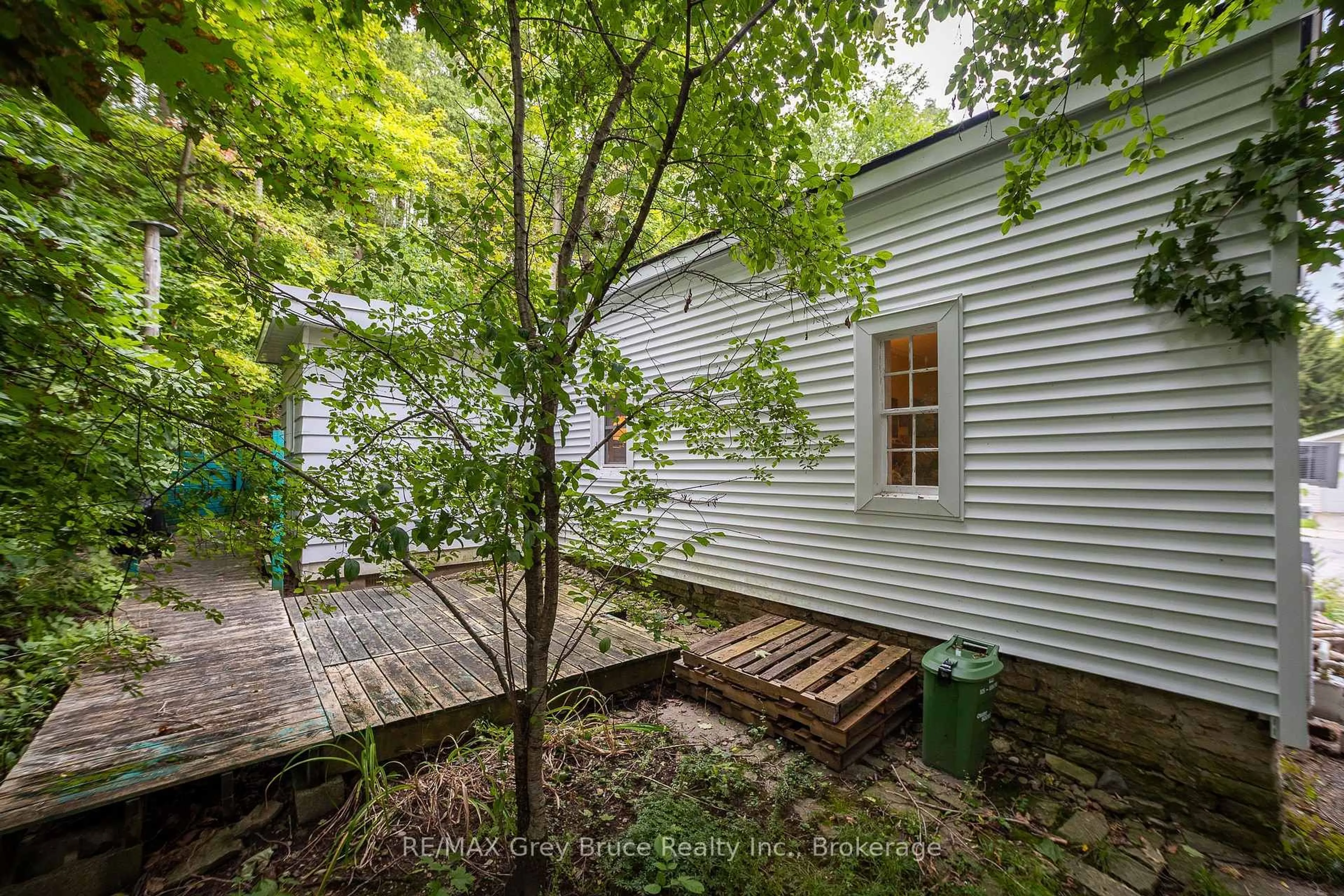 A pic from outside/outdoor area/front of a property/back of a property/a pic from drone, forest/trees view for 440 13th St, Owen Sound Ontario N4K 1W6