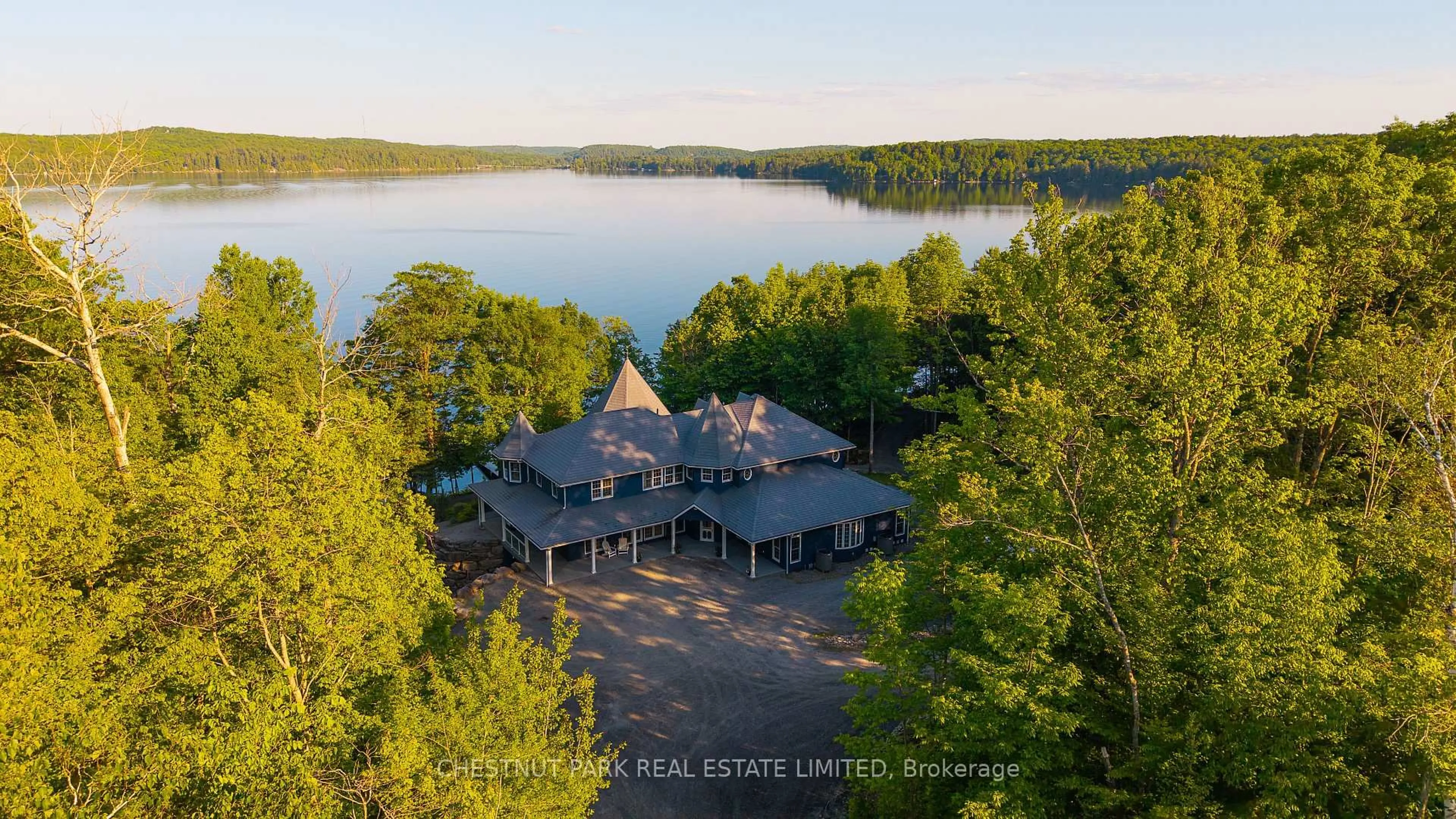 A pic from outside/outdoor area/front of a property/back of a property/a pic from drone, water/lake/river/ocean view for 1141 Nu-Ne Lane, Algonquin Highlands Ontario K0M 1S0