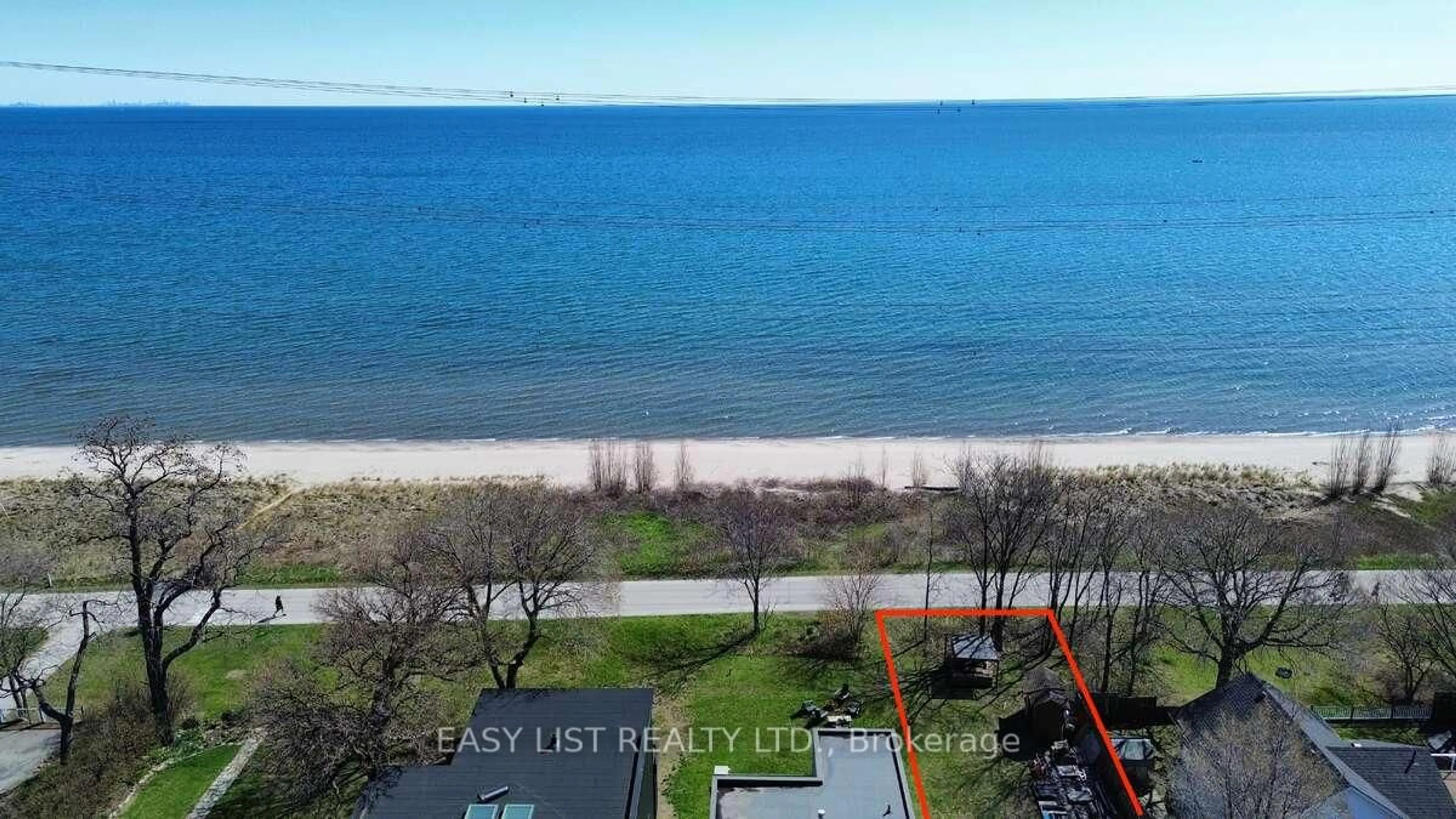A pic from outside/outdoor area/front of a property/back of a property/a pic from drone, water/lake/river/ocean view for 971 Beach Blvd, Hamilton Ontario L8H 6Z7