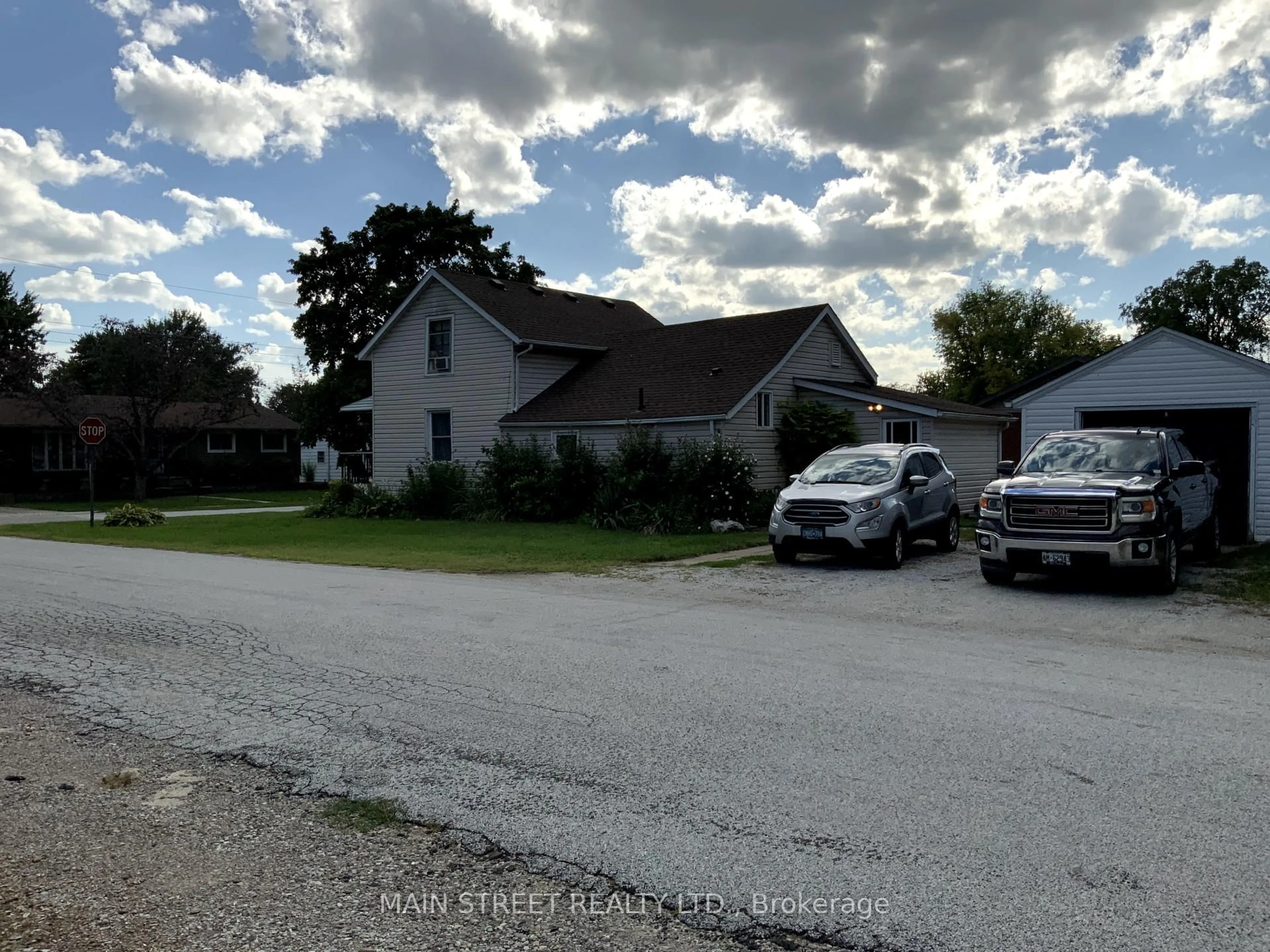 A pic from outside/outdoor area/front of a property/back of a property/a pic from drone, street for 523 Sarnia St, Plympton-Wyoming Ontario N0N 1T0