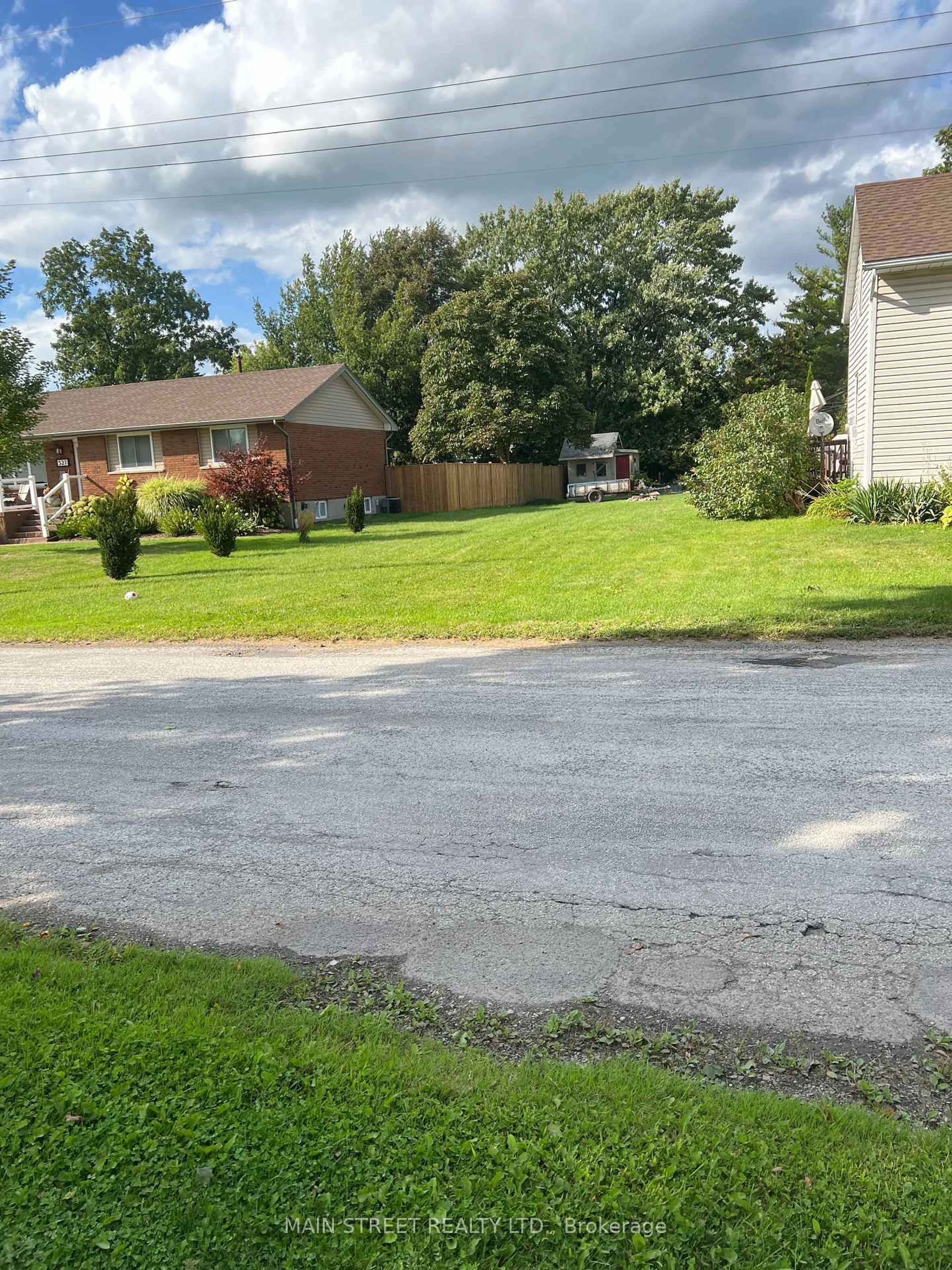 A pic from outside/outdoor area/front of a property/back of a property/a pic from drone, street for 523 Sarnia St, Plympton-Wyoming Ontario N0N 1T0