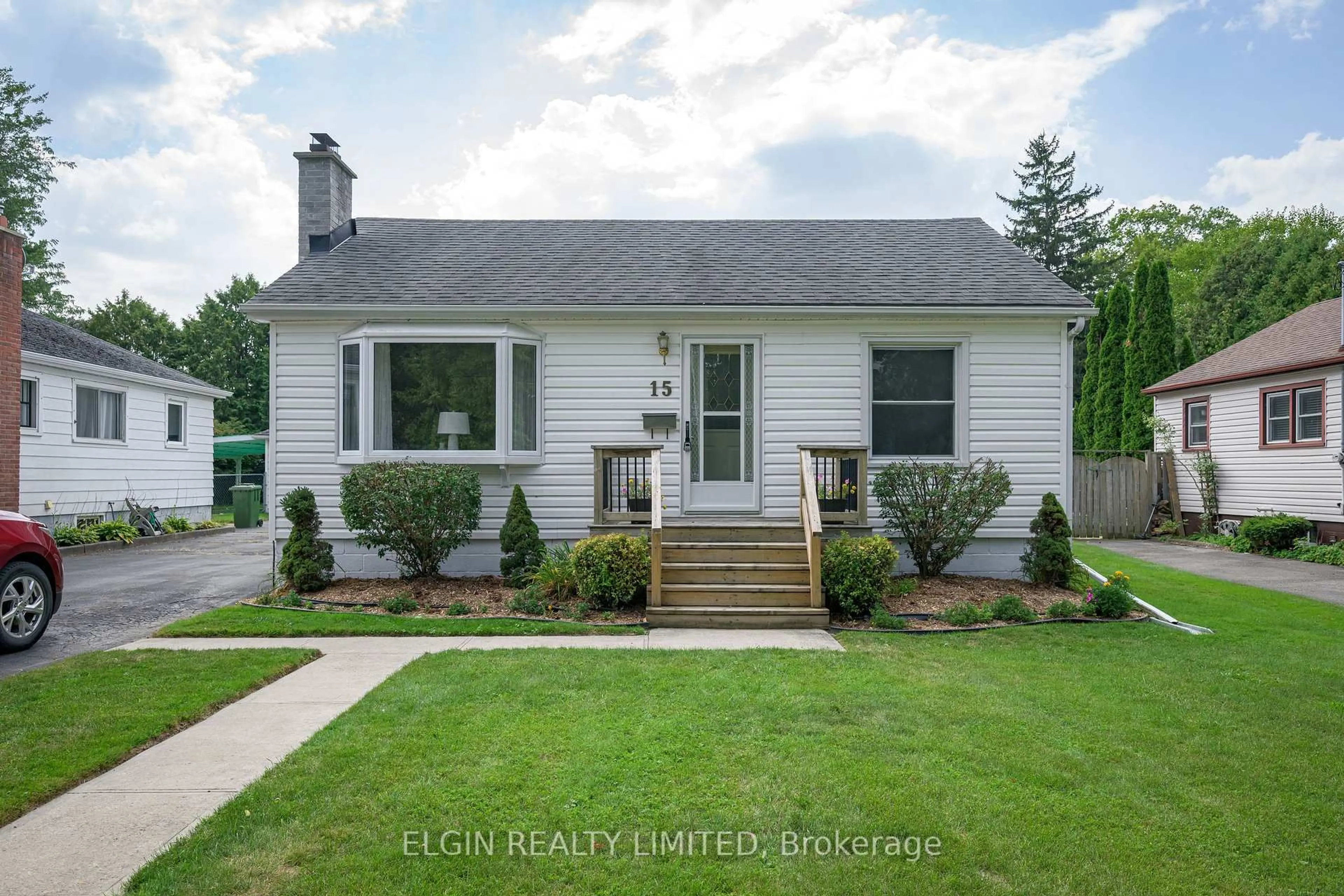 Home with vinyl exterior material, street for 15 Oak St, St. Thomas Ontario N5R 1R5