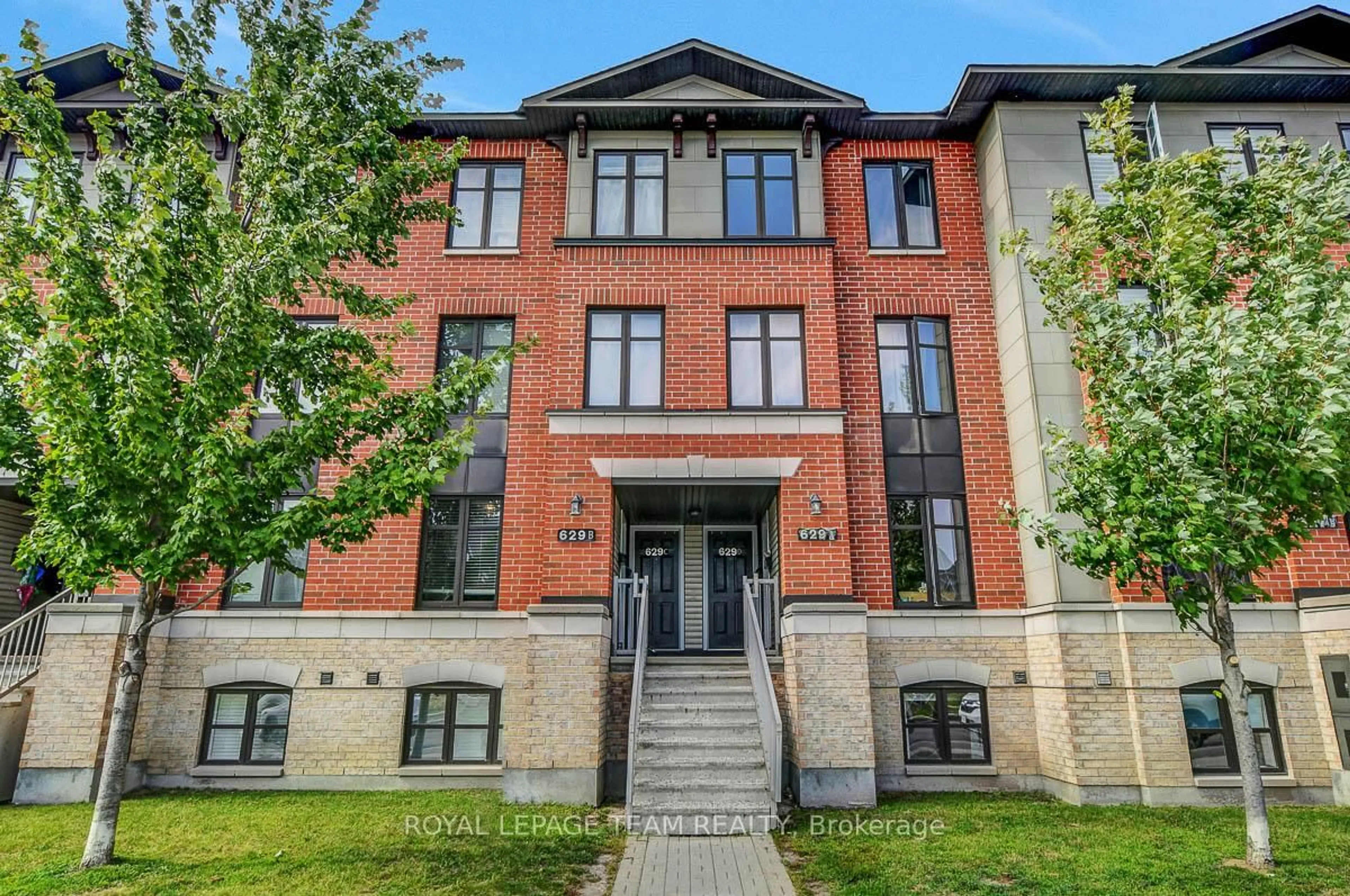 Home with brick exterior material, building for 629 Chapman Mills Dr #B, Ottawa Ontario K2J 5T1