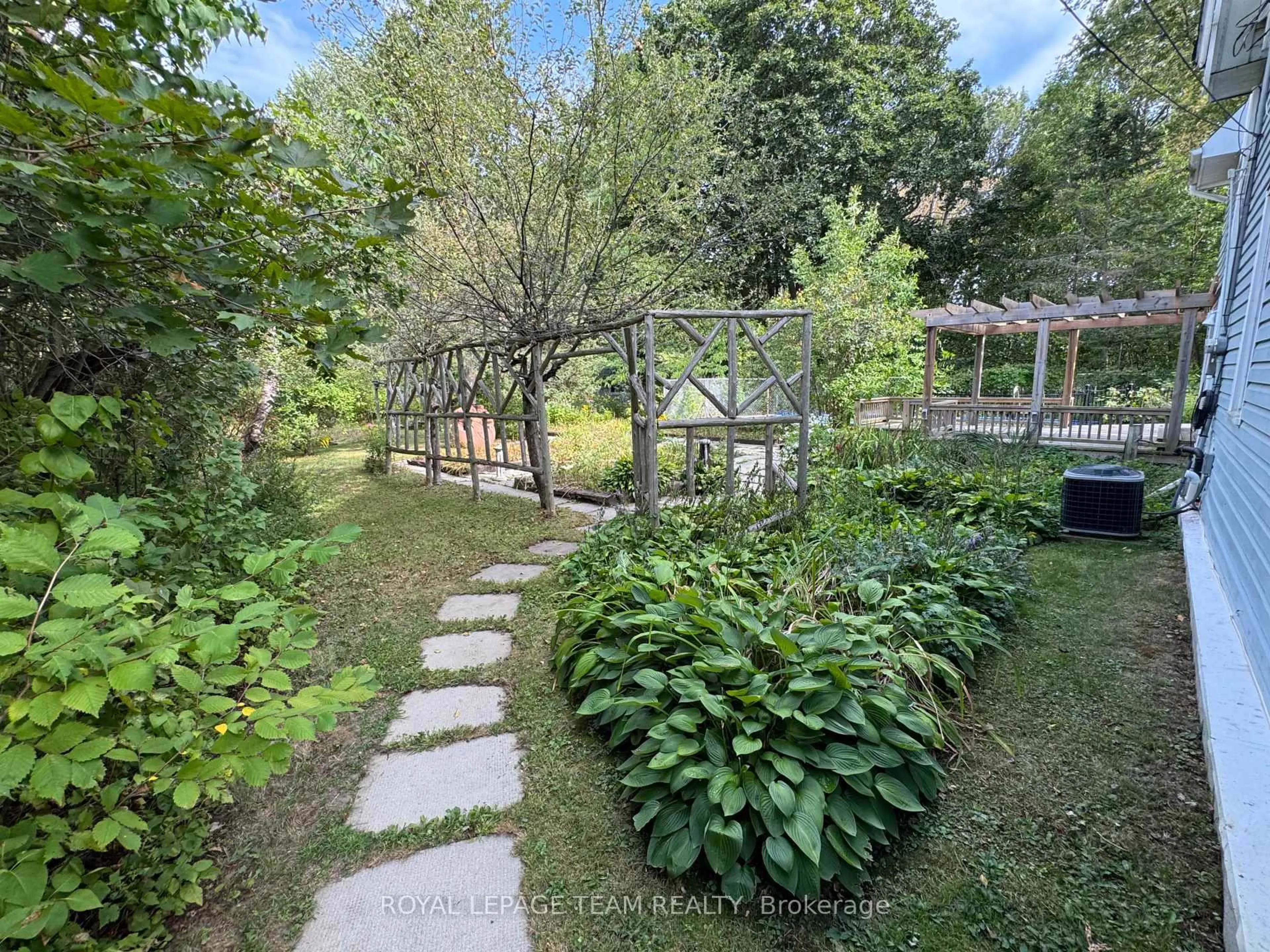A pic from outside/outdoor area/front of a property/back of a property/a pic from drone, forest/trees view for 1022 Bridge St, Ottawa Ontario K4M 1K4