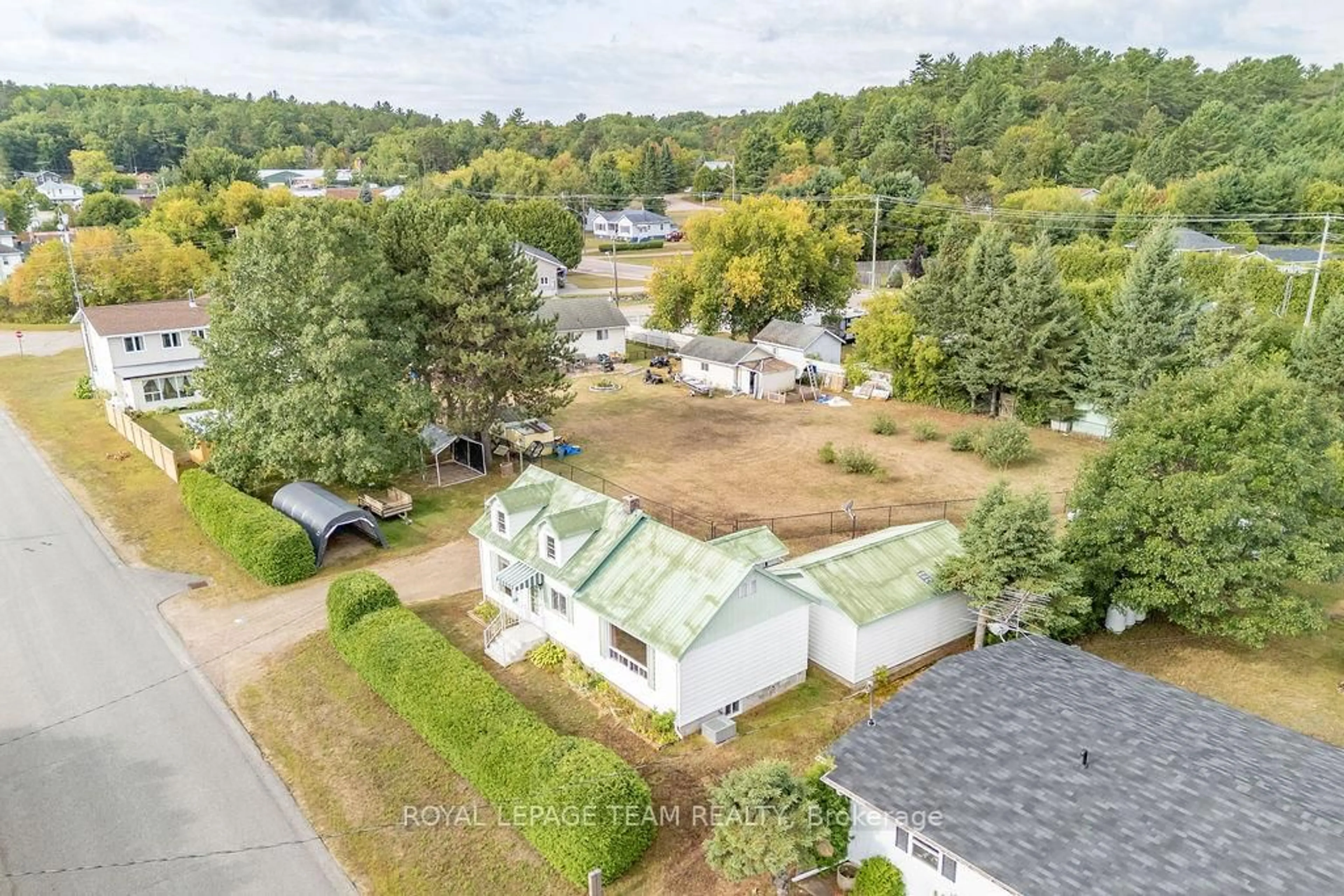A pic from outside/outdoor area/front of a property/back of a property/a pic from drone, water/lake/river/ocean view for 59 Drohan St, Whitney Ontario K0J 2M0