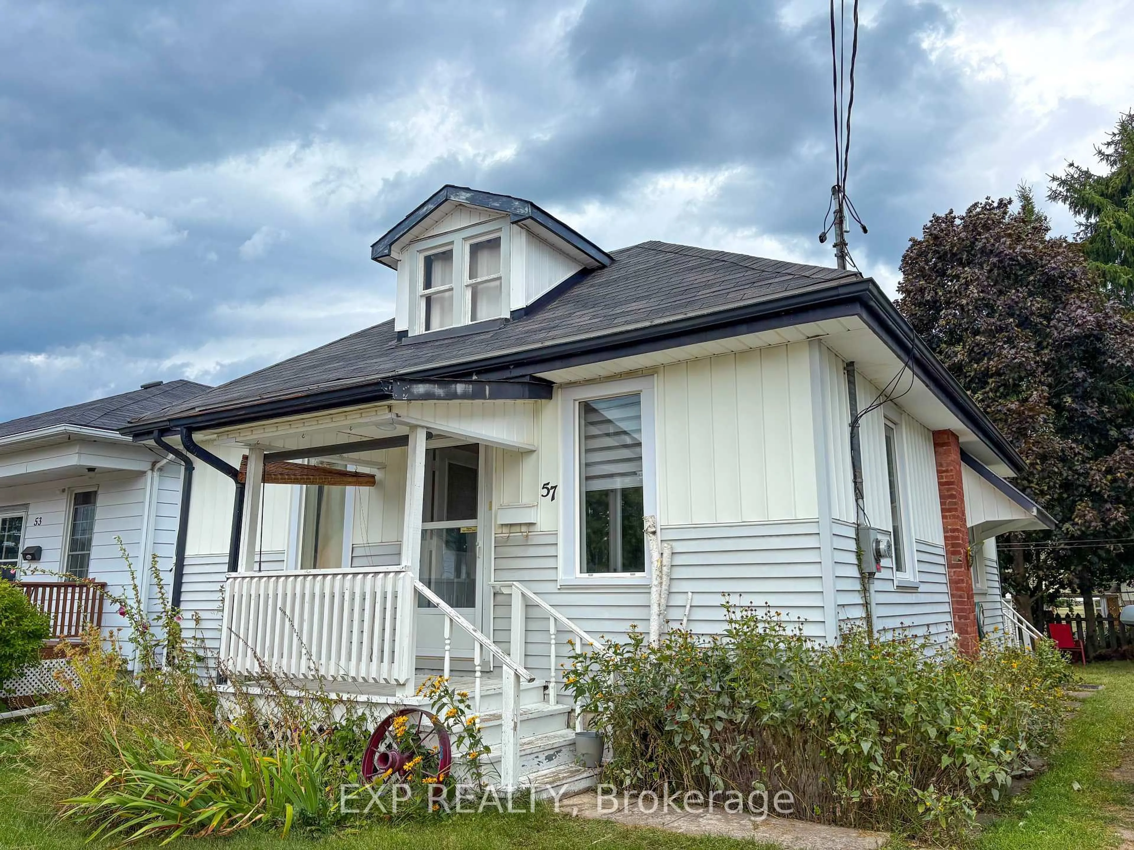 Home with vinyl exterior material, street for 57 Bank St, Renfrew Ontario K7V 2E5